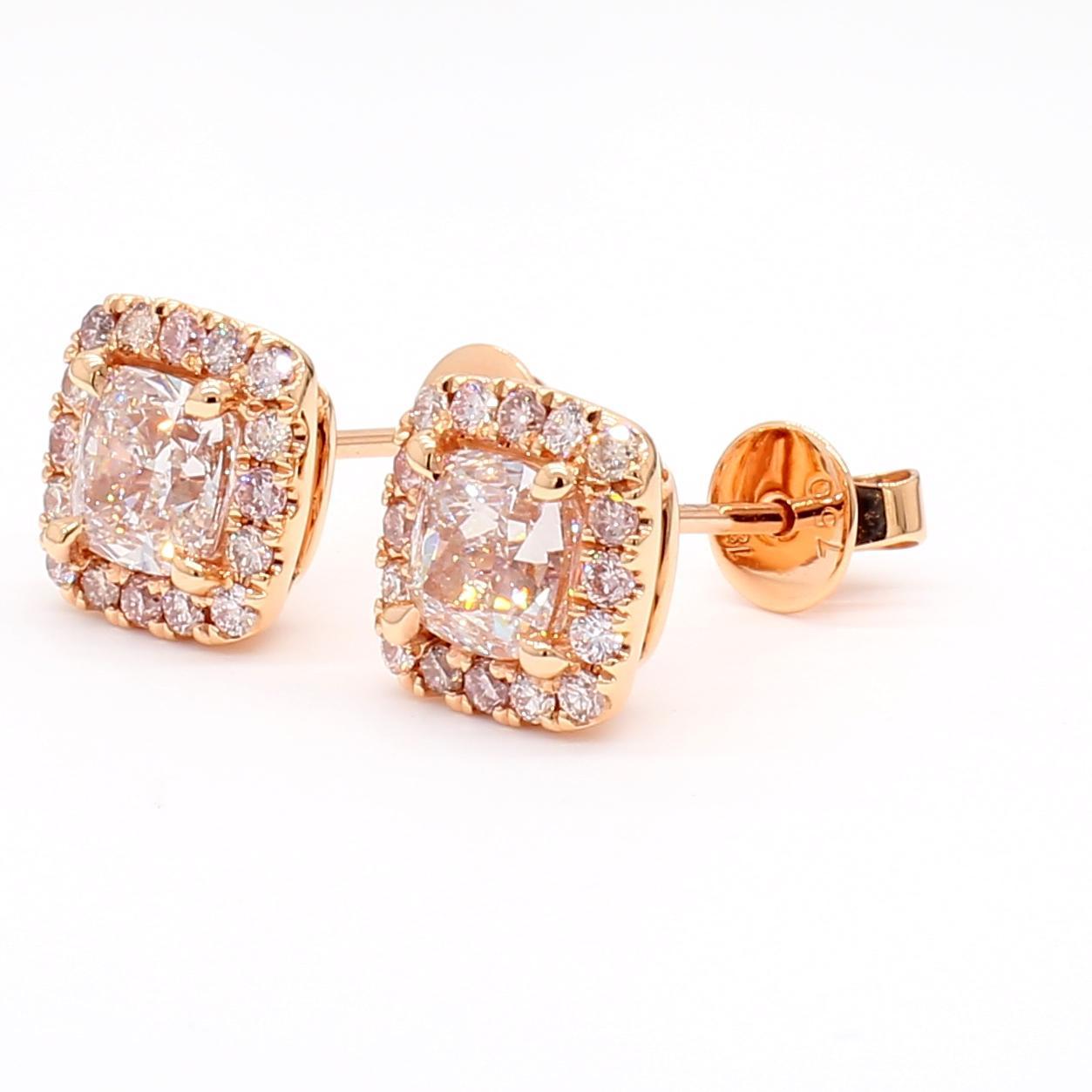 RareGemWorld's beautiful GIA certified diamond earrings. Mounted in a beautiful 18K Rose Gold setting with natural cushion cut pink diamonds. The pink diamonds are surrounded by round natural pink diamond melee. These earrings are guaranteed to
