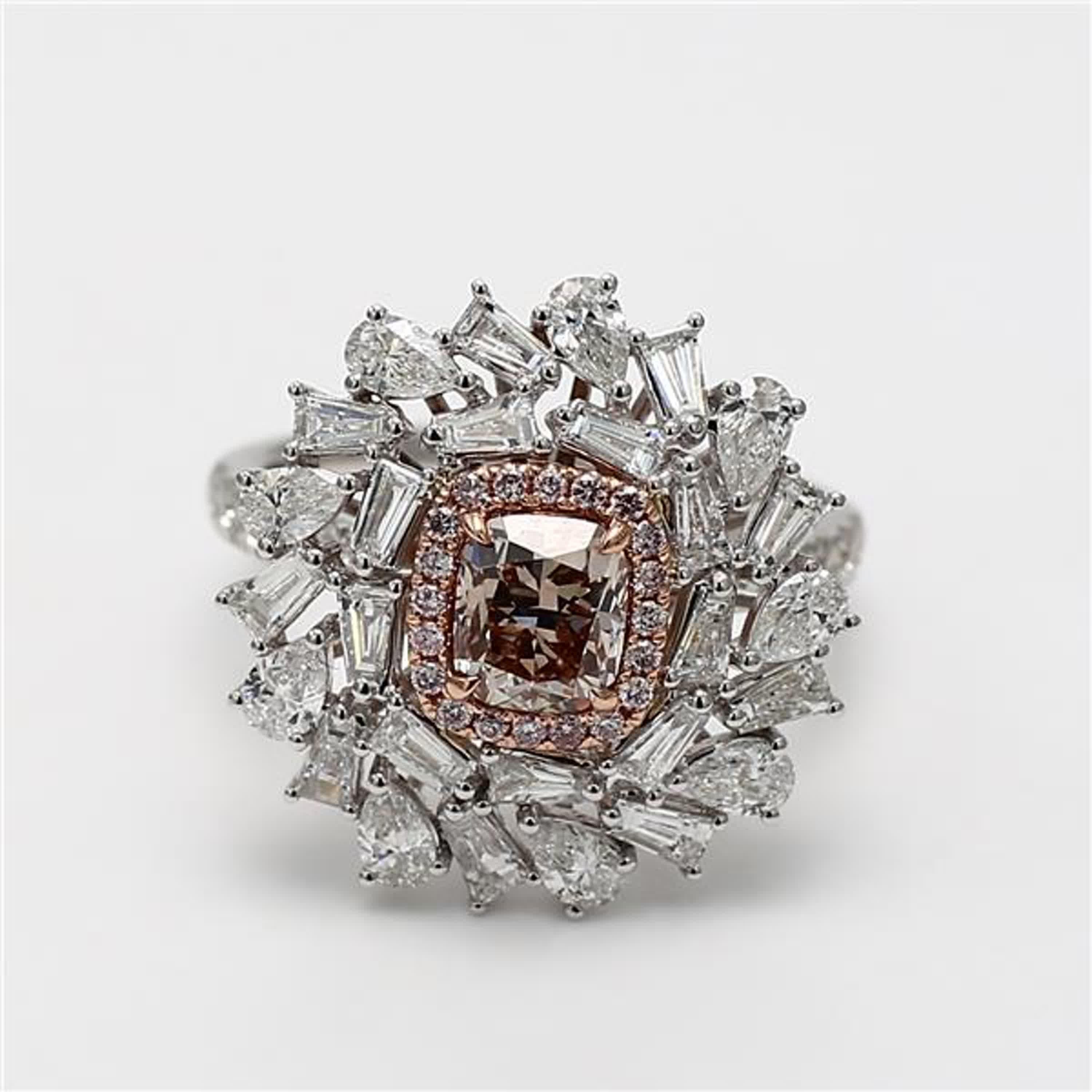 RareGemWorld's classic GIA certified diamond ring. Mounted in a beautiful 18K Rose and White Gold setting with a natural cushion cut pink diamond. The pink diamond is surrounded by round natural pink diamond melee, round natural white diamond melee,