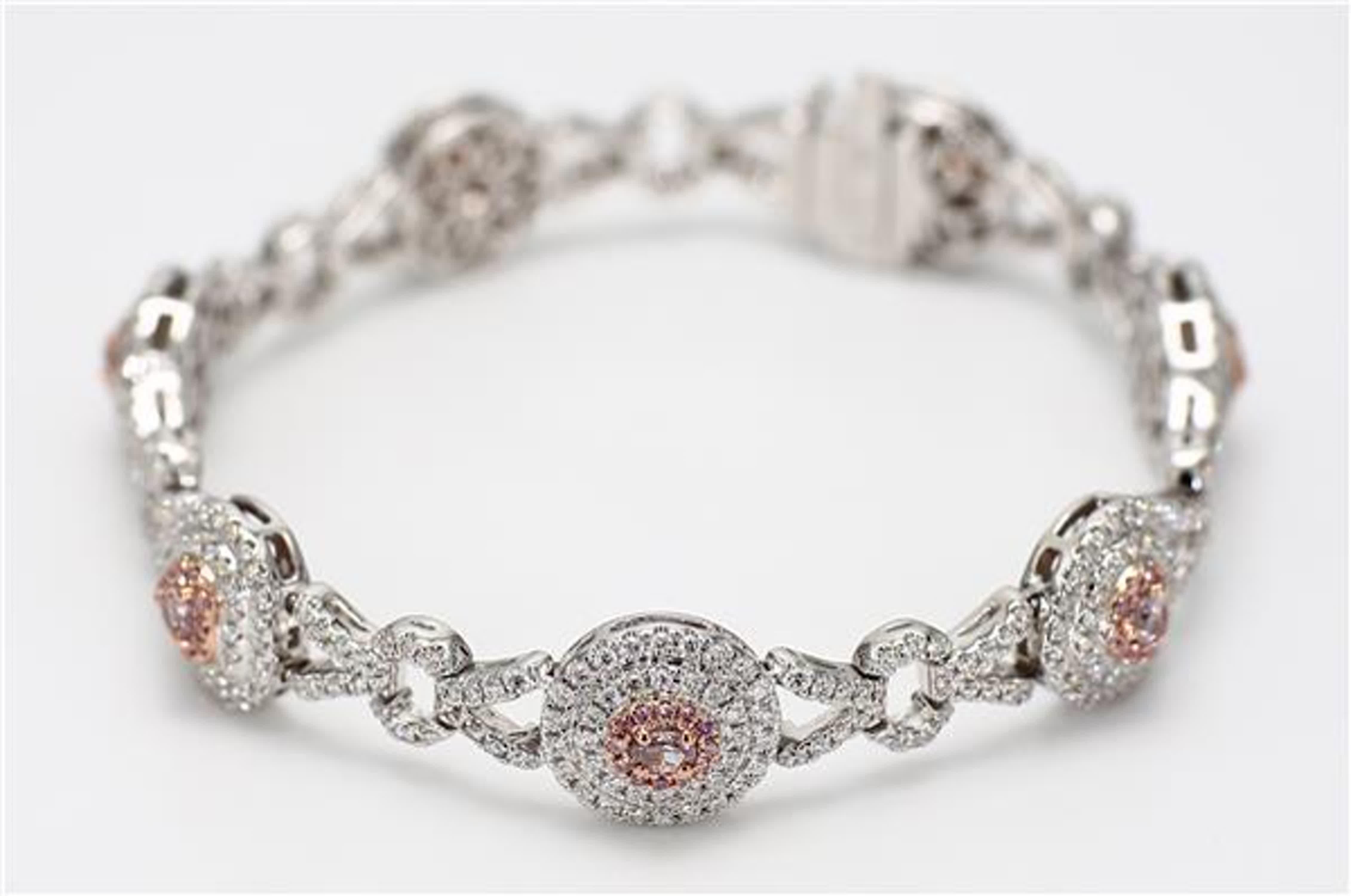 RareGemWorld's intriguing GIA certified diamond bracelet. Mounted in a beautiful 18K Rose and White Gold setting with natural pink heart cut diamonds, natural pink oval cut diamonds, and natural pink pear cut diamond. The pink diamonds are