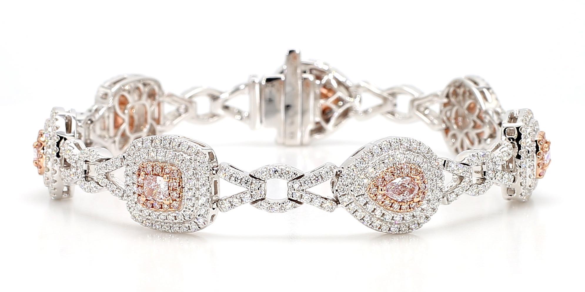 RareGemWorld's beautiful diamond bracelet. Mounted in a beautiful 18K Rose and White Gold setting with 3 natural cushion cut pink diamonds and 4 natural pear cut pink diamond. The pink diamonds are surrounded by small round natural white diamond
