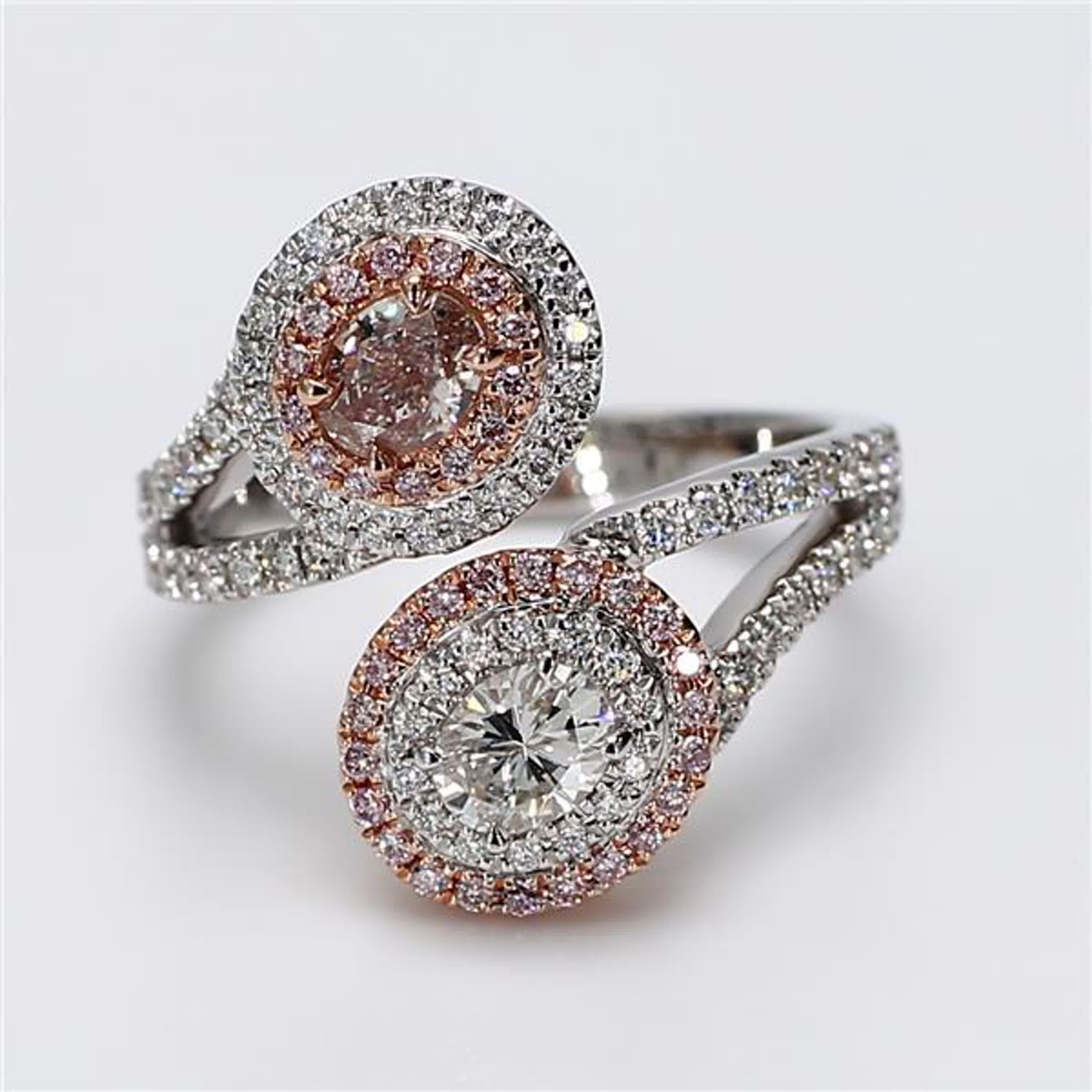 RareGemWorld's classic GIA certified diamond ring. Mounted in a beautiful 18K Yellow and White Gold setting with a natural oval cut pink diamond as well as a natural oval cut white diamond. The oval diamonds are surrounded by round natural pink