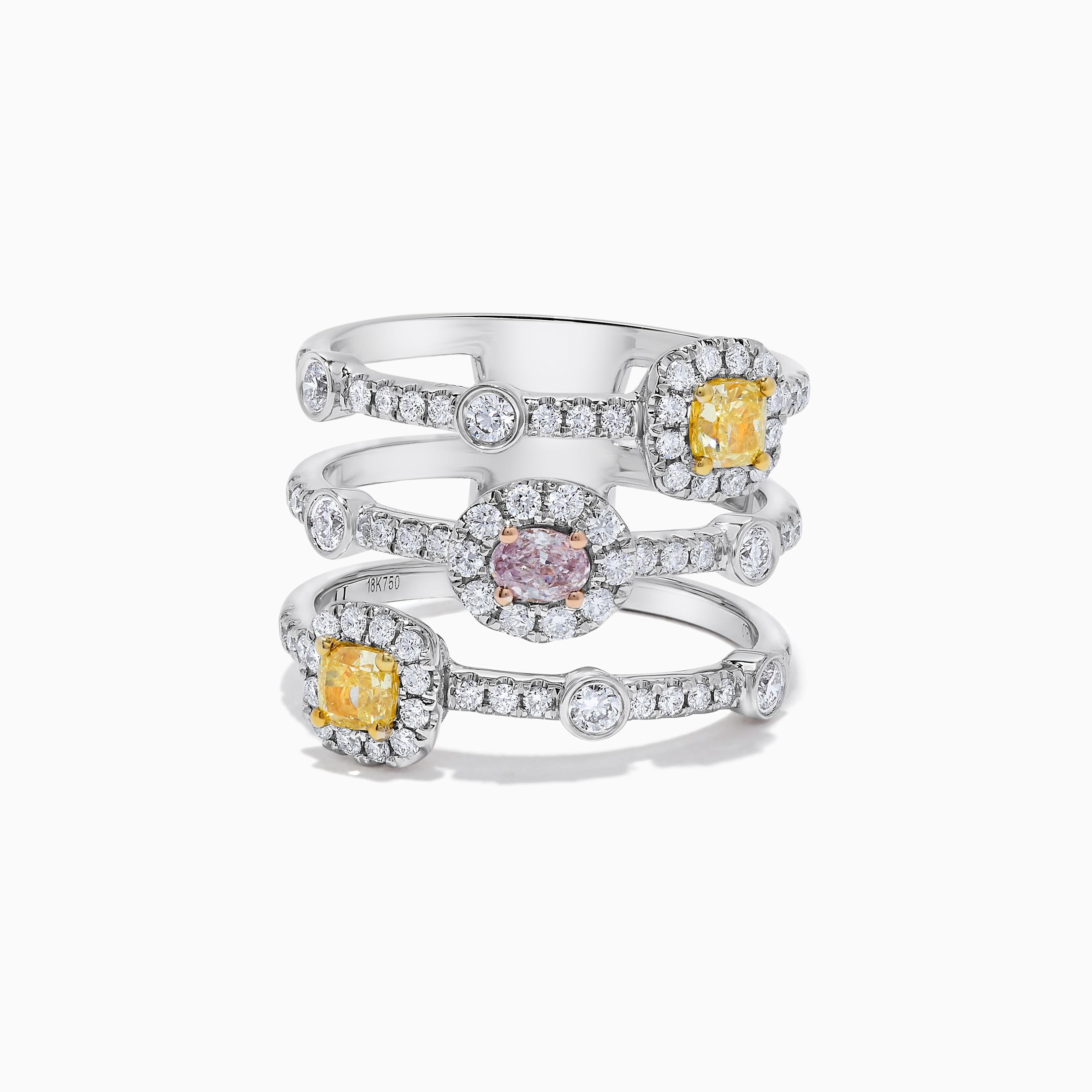RareGemWorld's classic GIA certified diamond ring. Mounted in a beautiful 18K Rose and White Gold setting with a natural oval cut pink diamond as well as two natural cushion cut yellow diamonds. The oval diamonds are surrounded by round natural