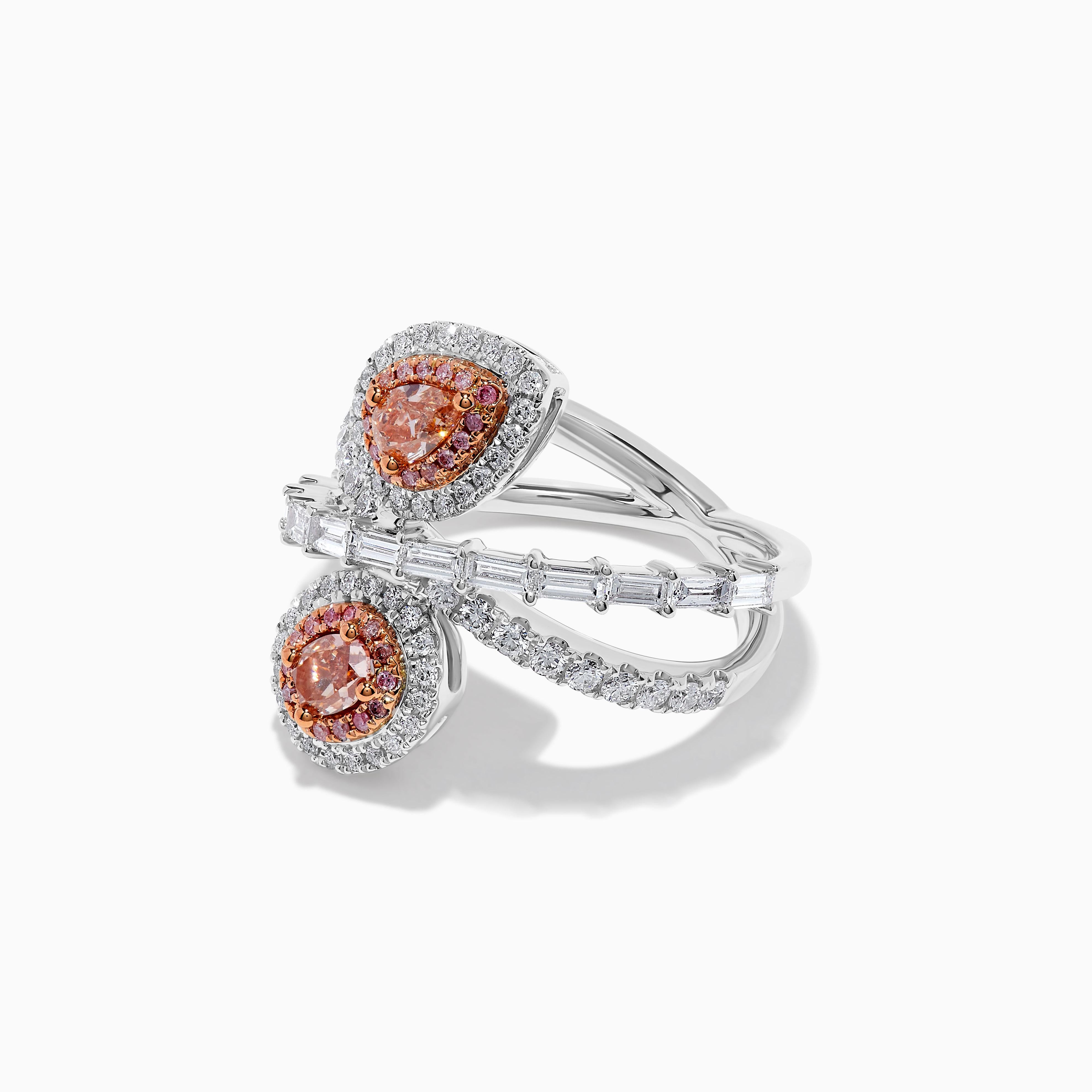 RareGemWorld's classic GIA certified diamond ring. Mounted in a beautiful 18K Rose and White Gold setting with a natural pear cut pink diamond complimented by a natural pink oval cut diamond. The diamonds are surrounded by natural baguette cut white