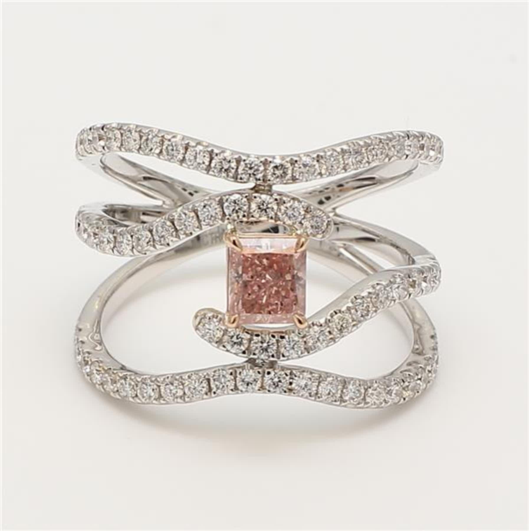 RareGemWorld's classic GIA certified diamond ring. Mounted in a beautiful 18K Rose and White Gold setting with a natural radiant cut pink diamond. The pink diamond is surrounded by round natural white diamond melee. This ring is guaranteed to