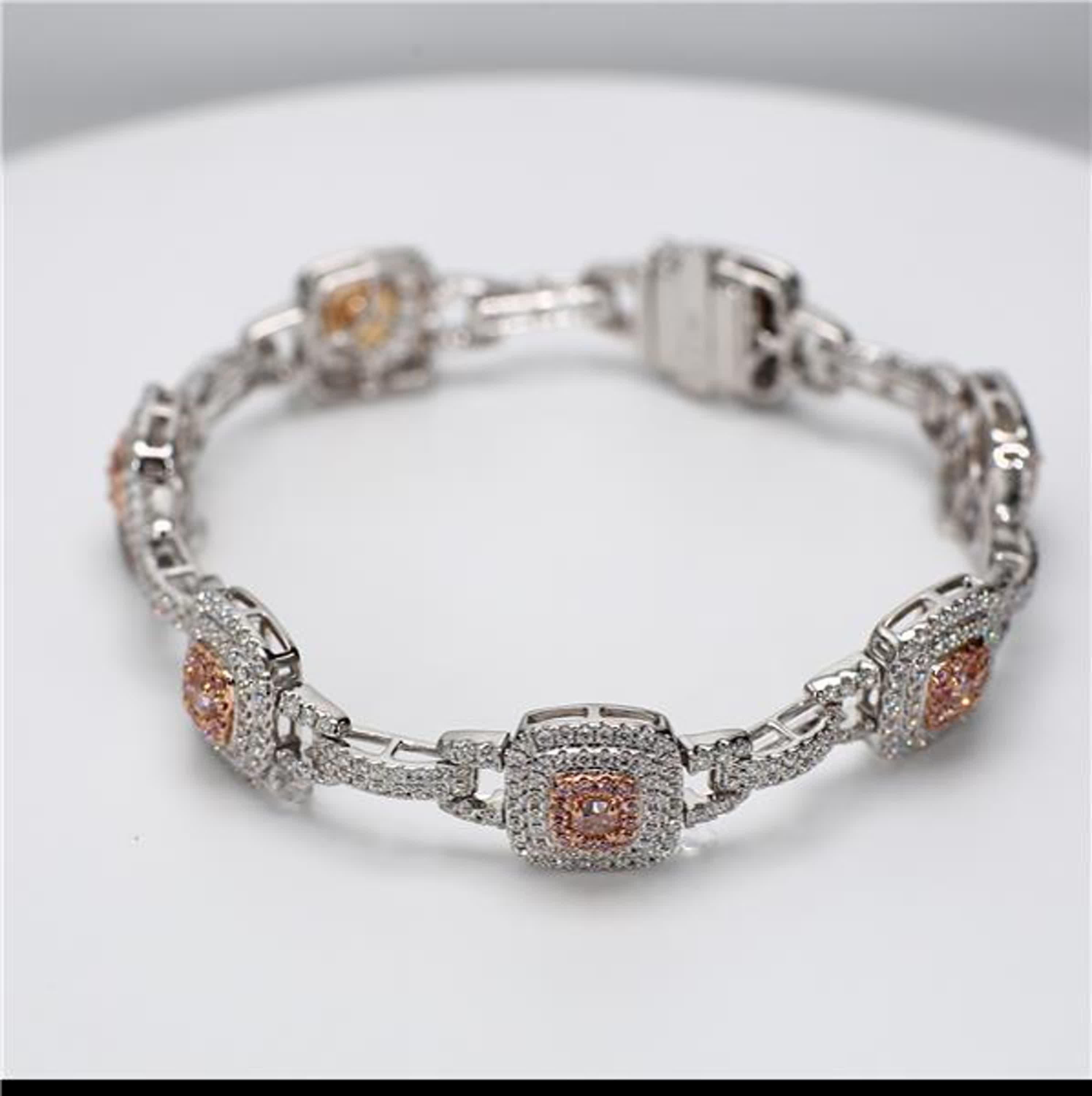 RareGemWorld's classic natural pink diamond bracelet. Mounted in a beautiful 18K Rose and White Gold setting with natural cushion cut pink diamonds and natural radiant cut pink diamonds. The pink diamonds are surrounded by small round natural white