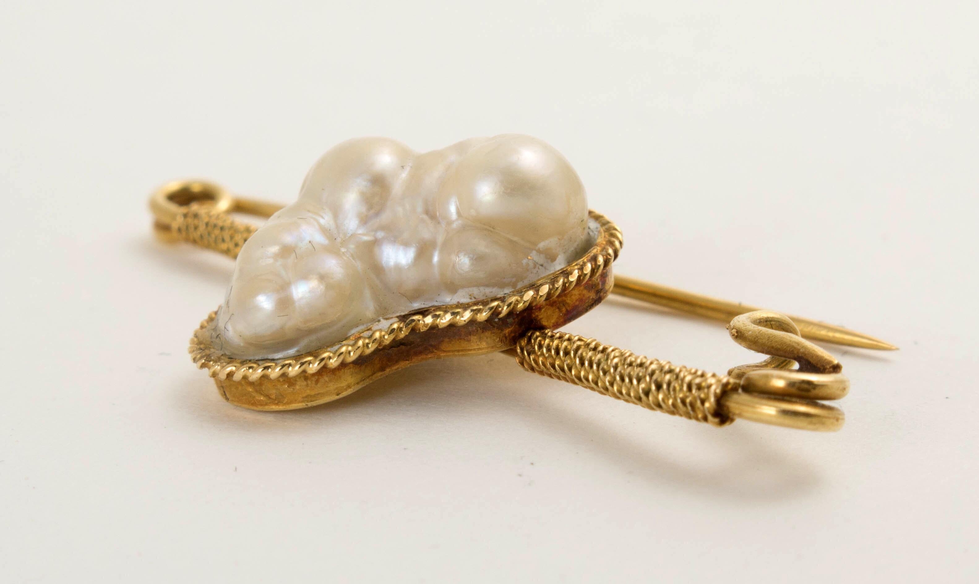 GIA certified blister pearl brooch in 14k yellow gold featuring one large natural saltwater blister pearl, undrilled. Come with Gemological Institute of America (GIA) report stating pearl size is 18.51 x 13.46 mm, cream body color, saltwater blister