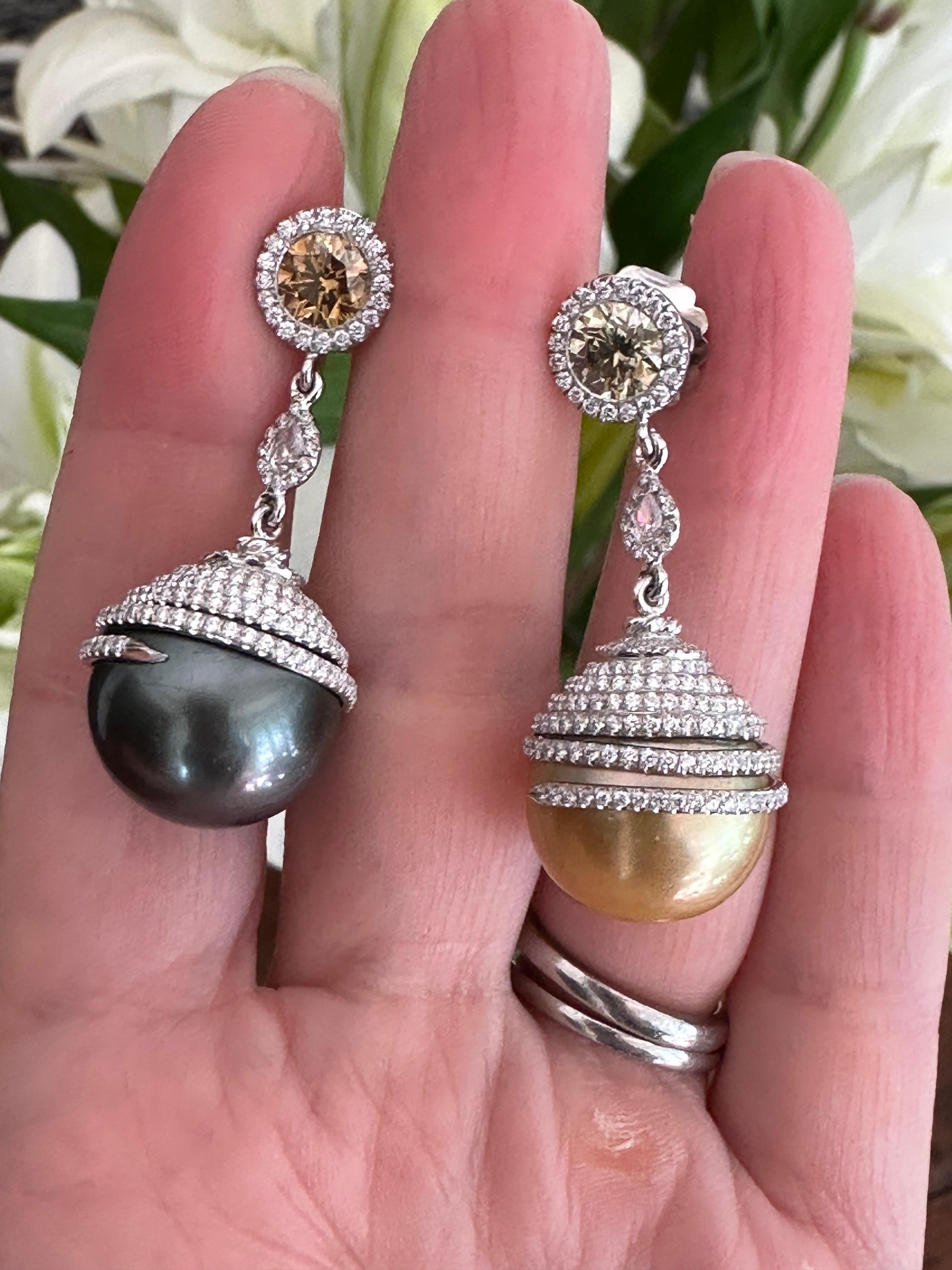 These exquisite earrings feature two large, luminous GIA-certified natural saltwater pearls.  Farmed from the pinctada margaritifera, or black-lipped oyster, and the pinctada maxima, the gold-lipped pearl oyster, these large gems possess the most