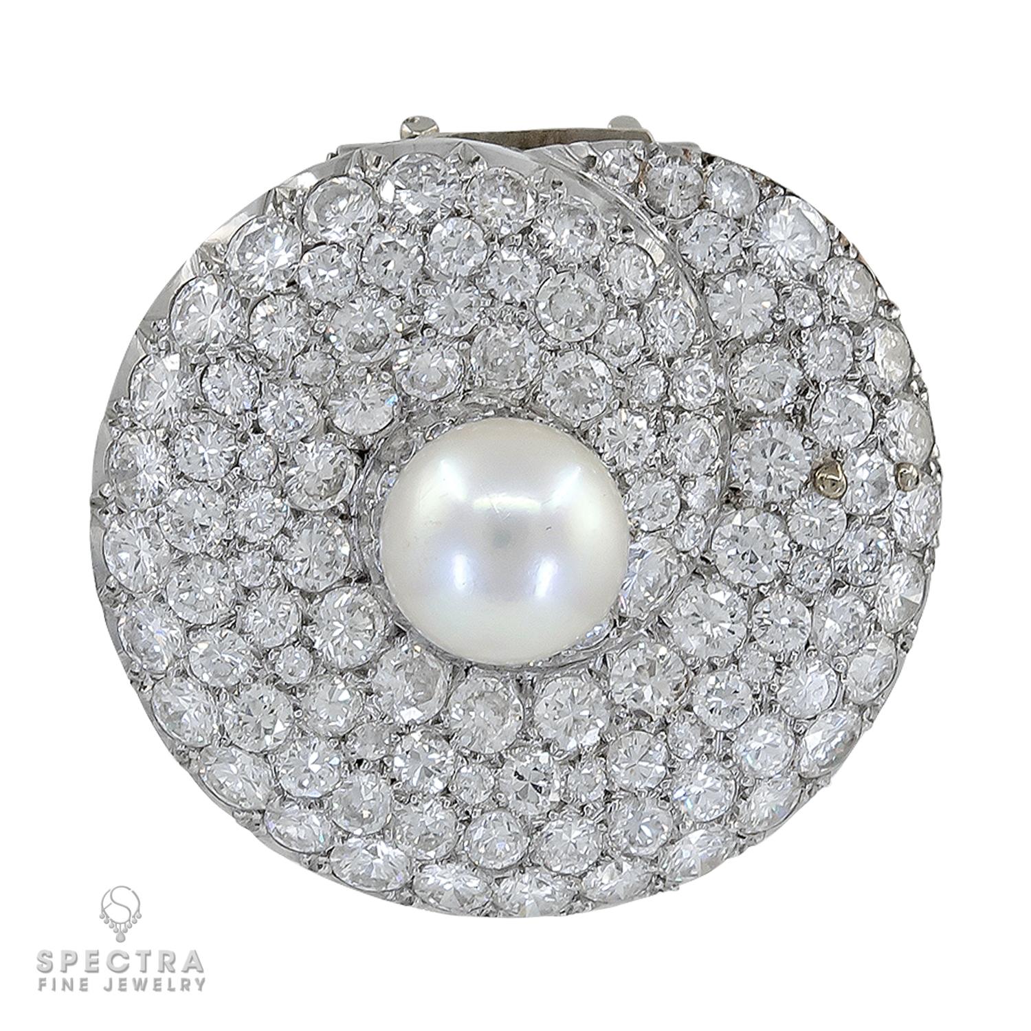 This exquisite platinum brooch showcases timeless elegance and exceptional craftsmanship. At its heart is a stunning 9.94 mm natural saltwater pearl, certified by GIA and displaying a luminous, untreated beauty. Encircling the pearl is a dazzling