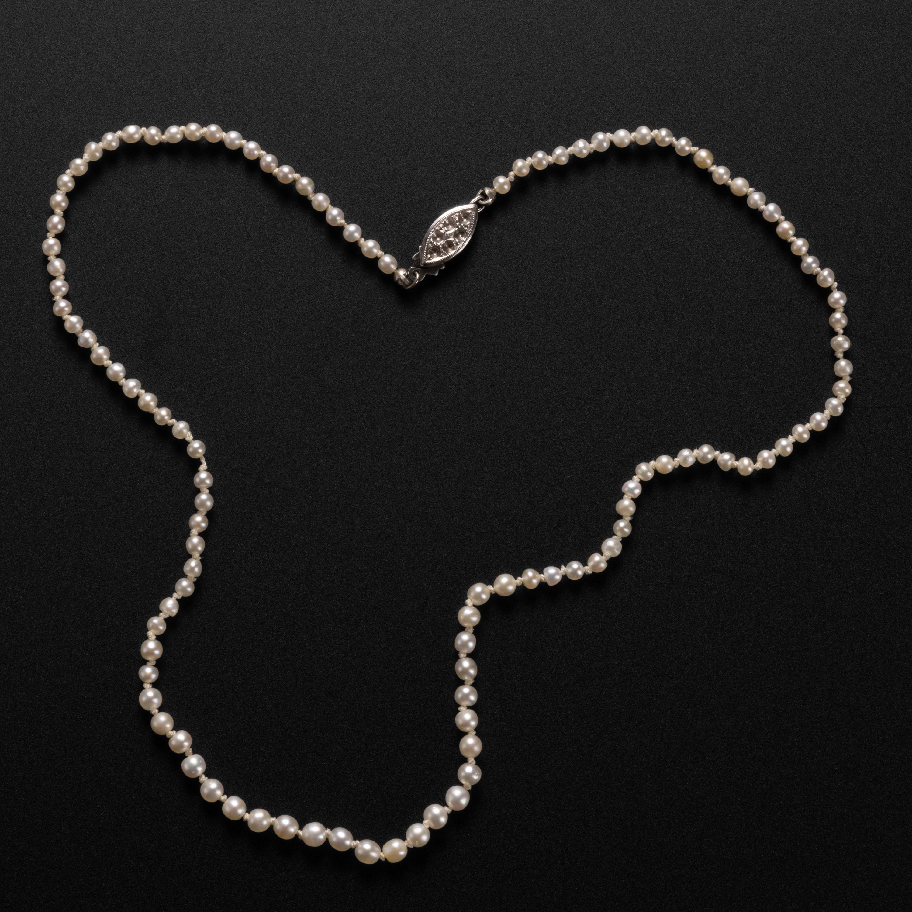 An almost unbearably beautiful necklace composed of one-hundred-and-eleven GIA certified natural, uncultured saltwater pearls. The brief 15