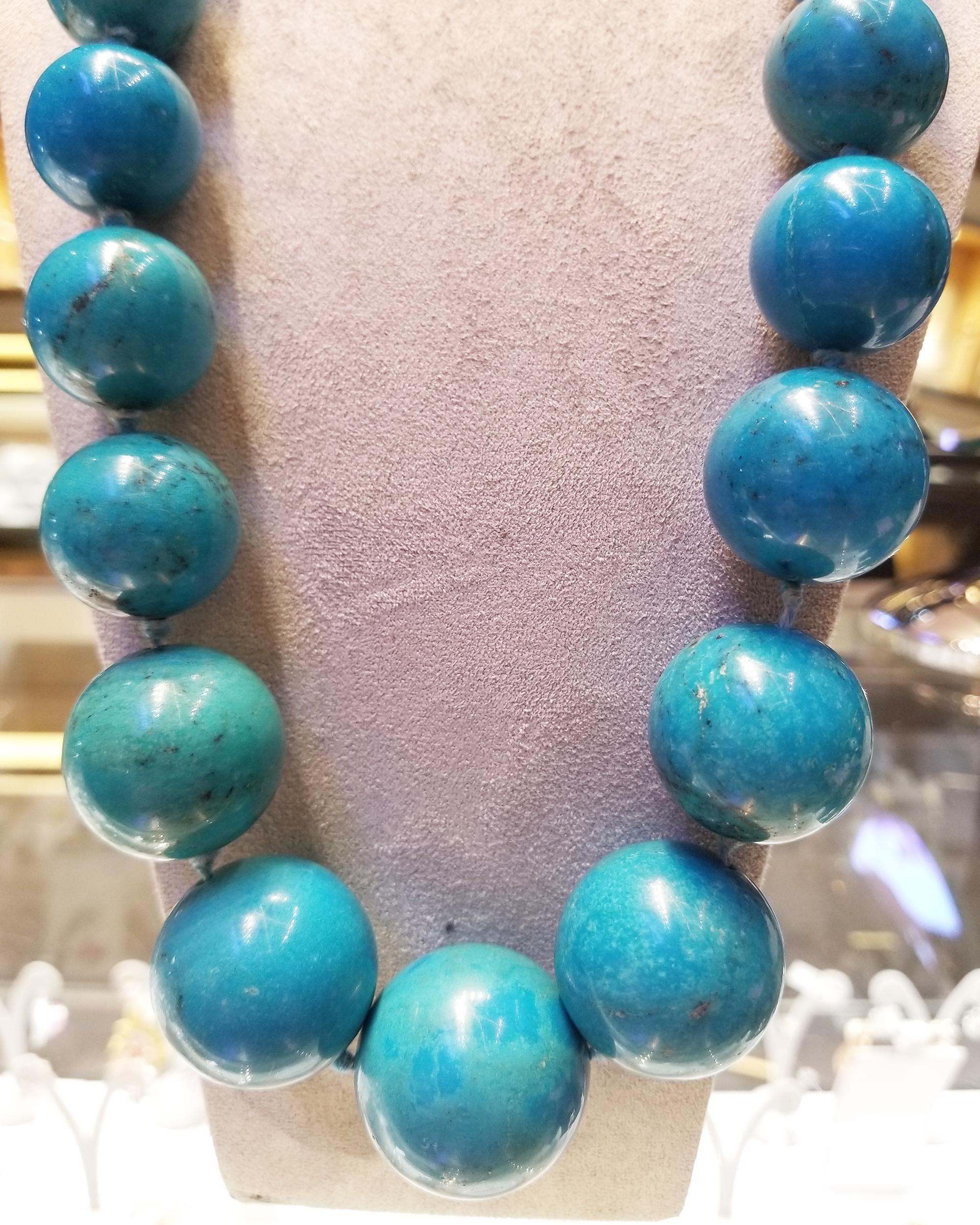 A gorgeous necklace made of natural turquoise. 
358.80 grams of impregnated greenish blue beads in a graduated single strand necklace
with an 18k yellow gold clasp.
Measurements: 25.99 x 25.90 mm to 30.05 x 29.87 mm
Five beads are GIA
