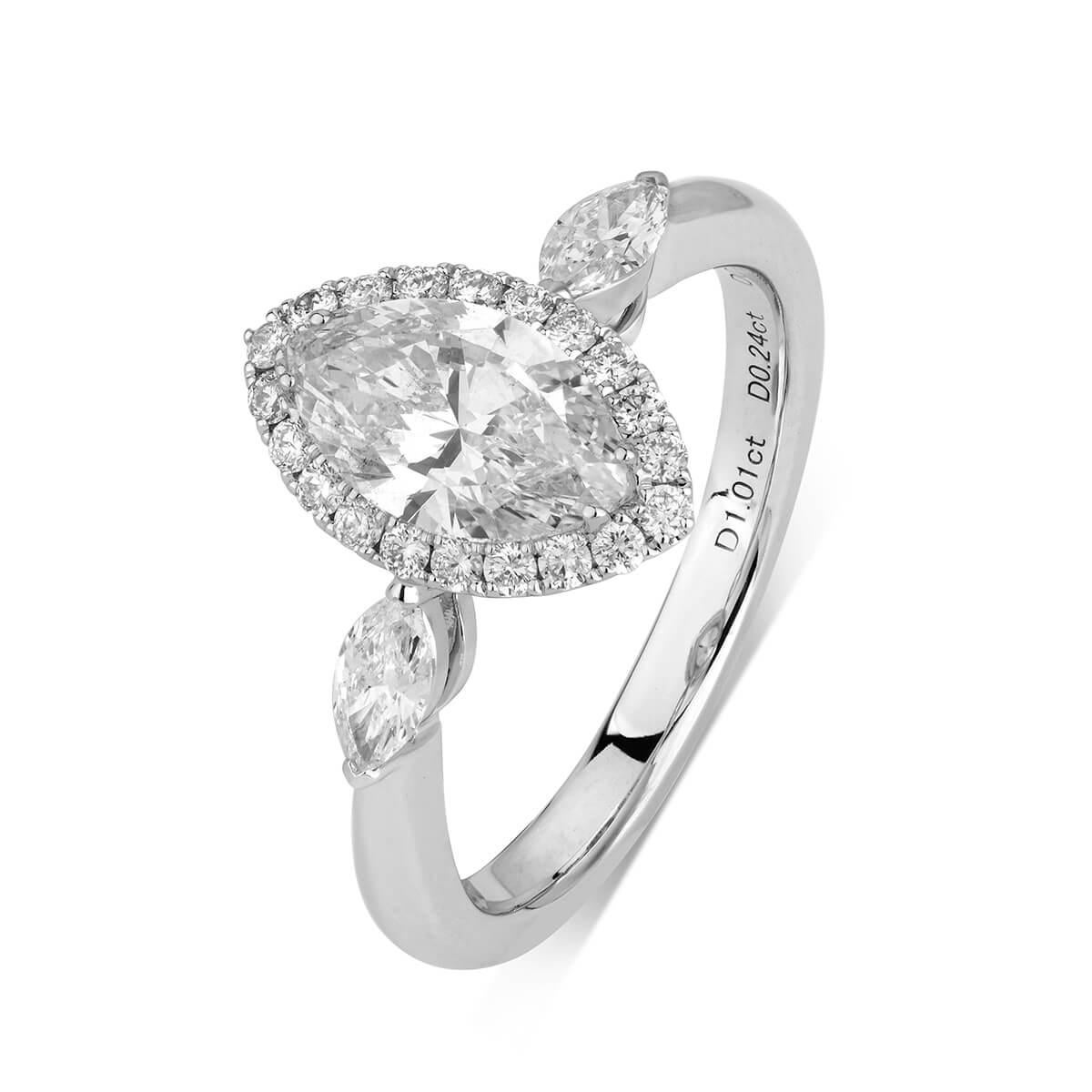 This timeless piece hosts one main 1.01 carat natural untreated white diamond of marquise shape. It is stunningly surrounded by smaller natural white diamonds making up a total carat weight of 1.43. The main stone is marquise shape and is GIA