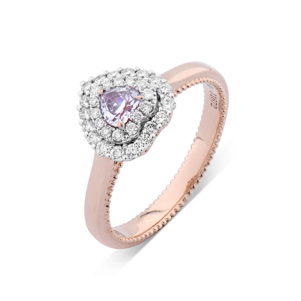 This beautiful piece consists of a 0.20 Carat Natural Light Pink Heart Shaped Diamond surrounded by smaller natural white diamonds making up a total of 0.47 Carats. 
This piece is GIA certified and has been expertly crafted using 18 Karat Rose Gold.