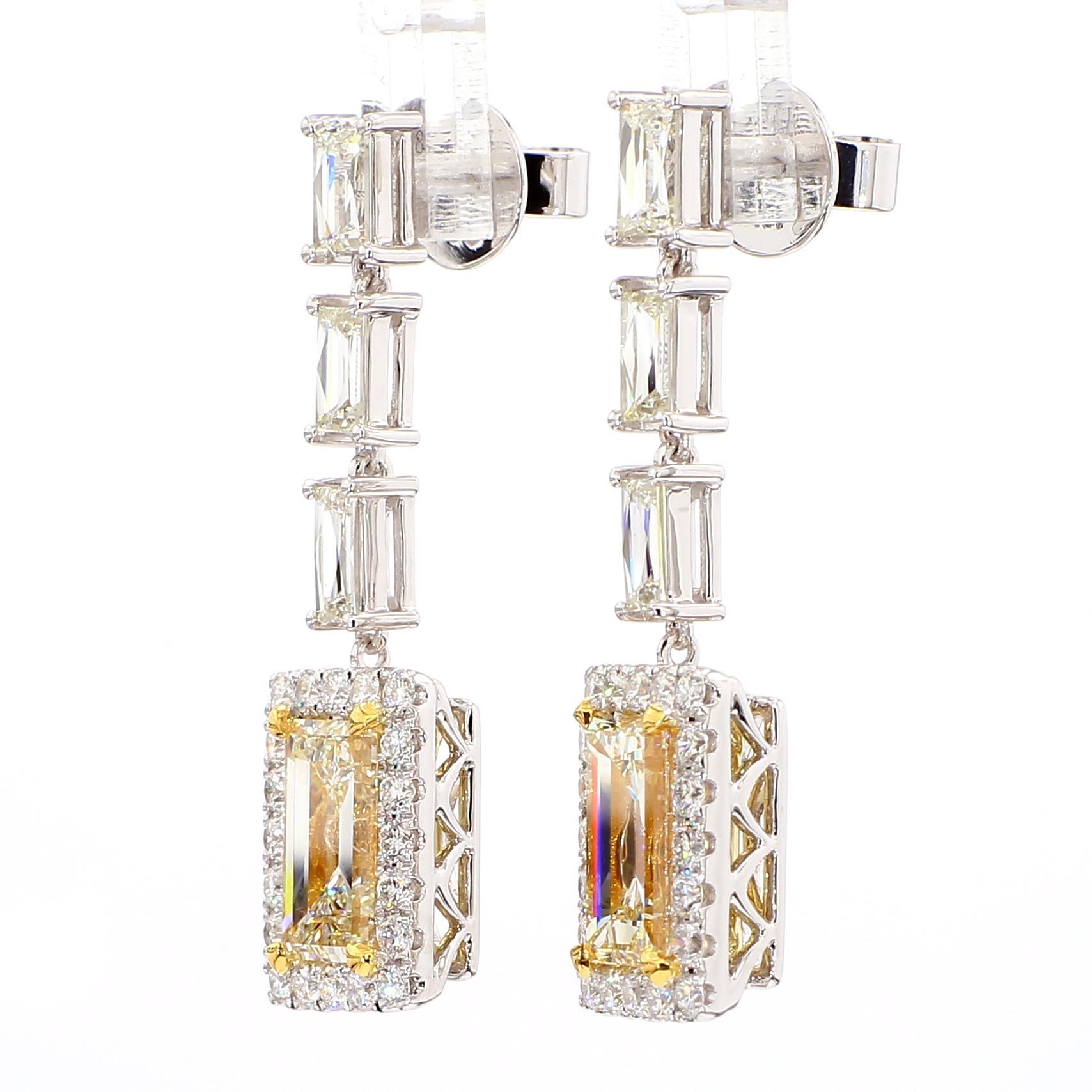 RareGemWorld's beautiful GIA certified diamond earrings. Mounted in a beautiful 18K Yellow and White Gold setting with natural baguette cut yellow diamonds complimented by natural white baguette cut diamonds and natural white round cut diamonds.