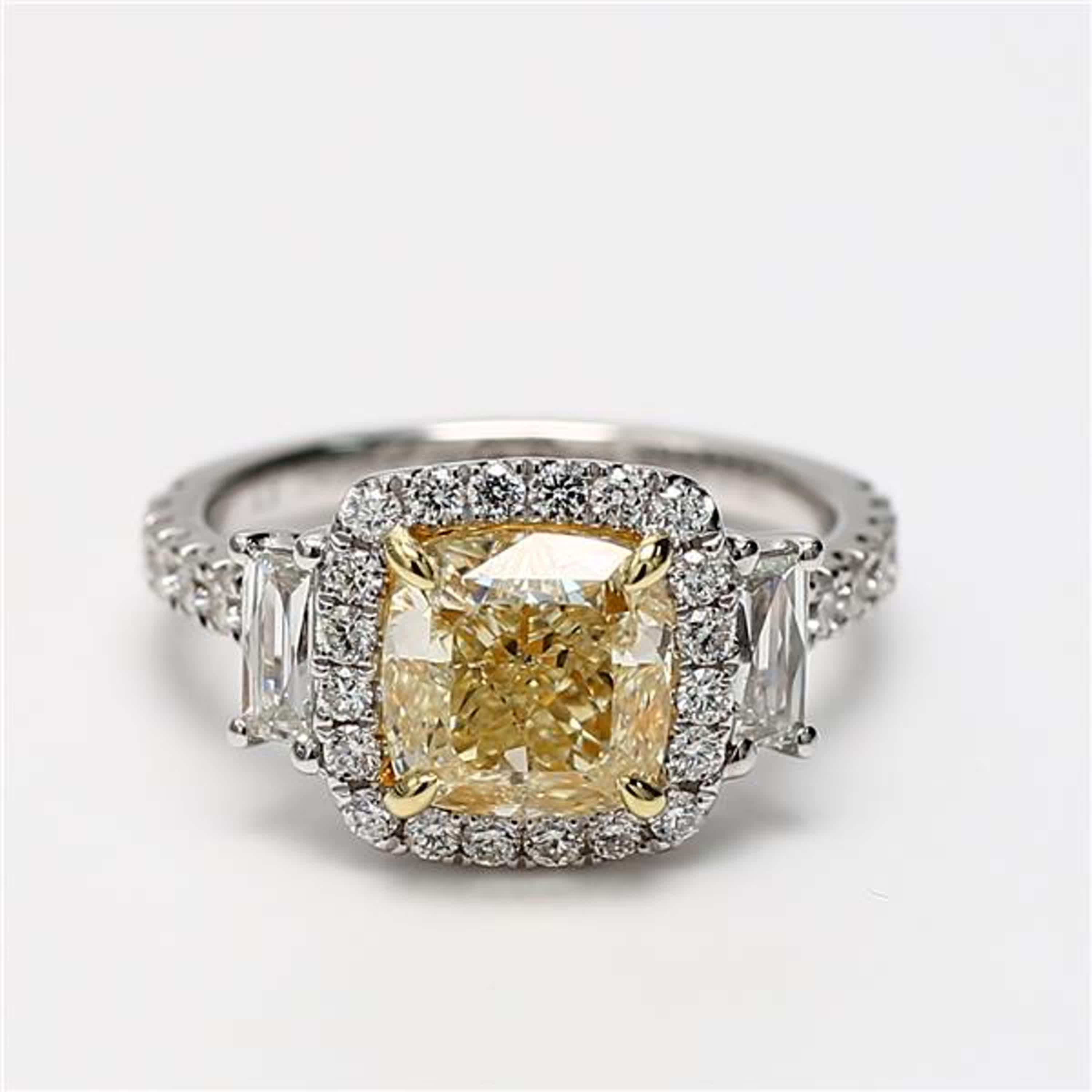 RareGemWorld's classic GIA certified diamond ring. Mounted in a beautiful 18K Yellow and White Gold setting with a natural cushion cut yellow diamond. The yellow diamond is surrounded by natural baguette white diamonds and round natural white