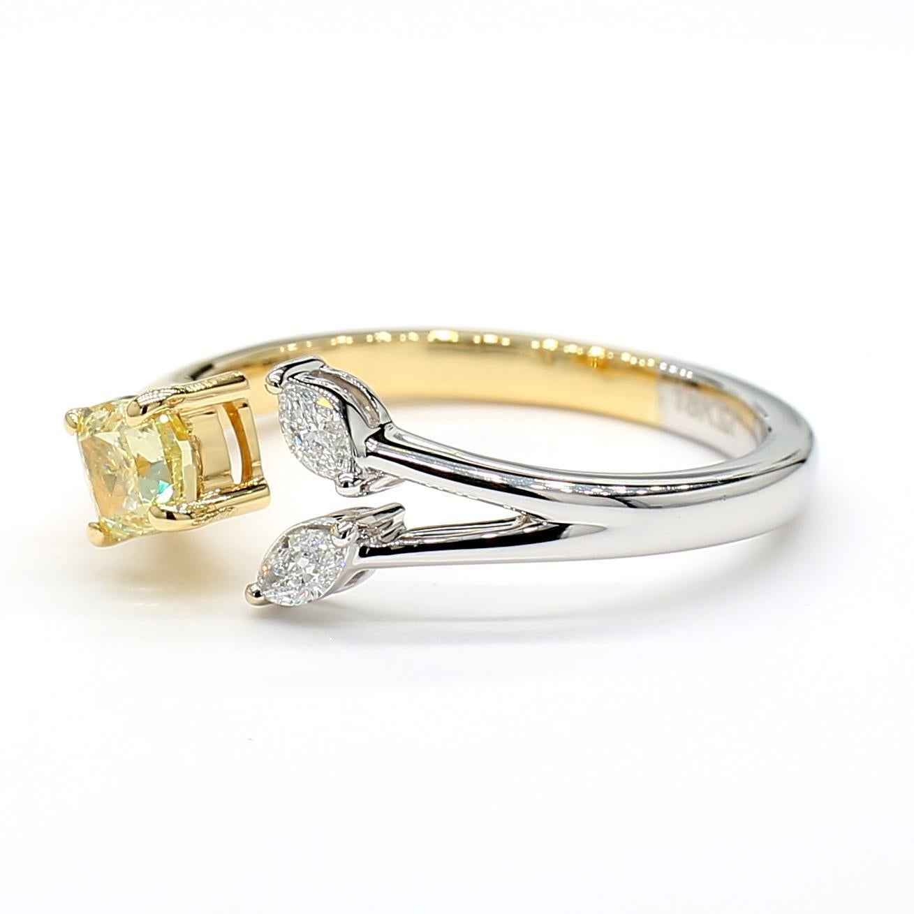RareGemWorld's beautiful GIA certified diamond ring. Mounted in a beautiful 18K Yellow and White Gold setting with a natural cushion cut yellow diamond. The yellow diamond is surrounded by natural marquise cut white diamonds. This ring is guaranteed