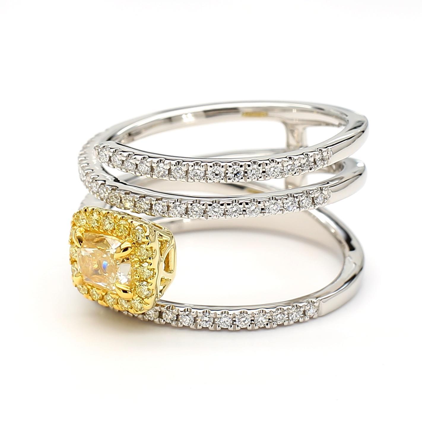 RareGemWorld's beautiful GIA certified diamond ring. Mounted in a beautiful 18K Yellow and White Gold setting with a natural cushion cut yellow diamond. The yellow diamond is surrounded by round natural yellow diamond melee and round natural white