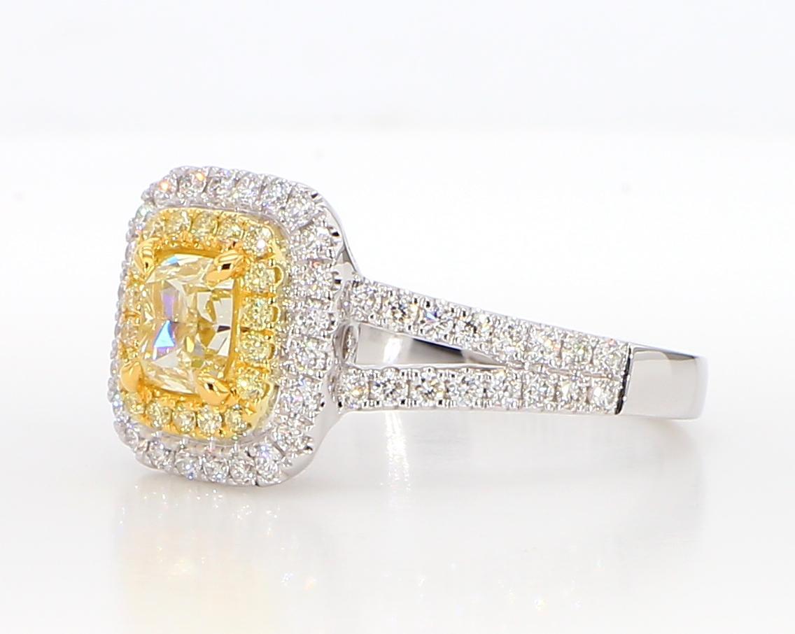 RareGemWorld's beautiful GIA certified diamond ring. Mounted in a beautiful 18K Yellow and White Gold setting with a natural cushion cut yellow diamond. The yellow diamond is surrounded by round natural yellow diamond melee and round natural white