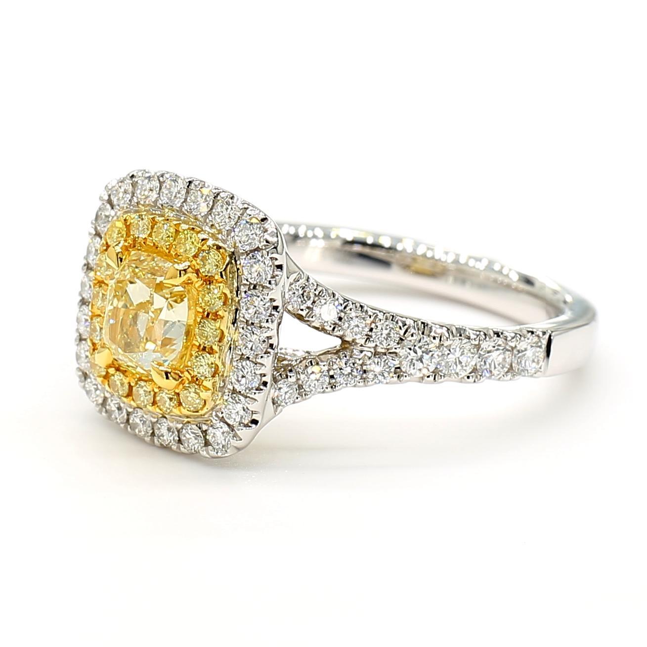 RareGemWorld's beautiful GIA certified diamond ring. Mounted in a beautiful Platinum setting with a natural cushion cut yellow diamond. The yellow diamond is surrounded by round natural yellow diamond melee and round natural white diamond melee.