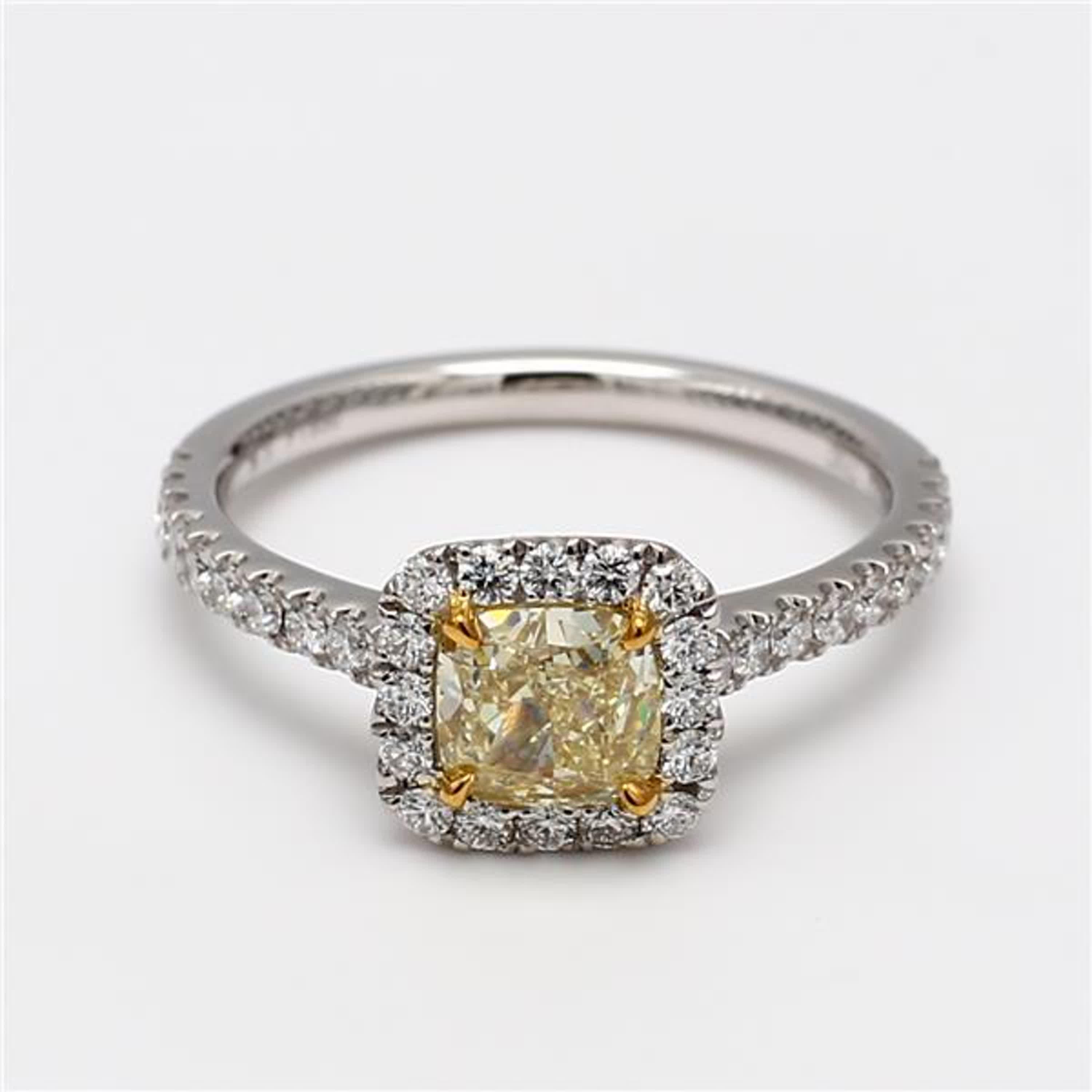 RareGemWorld's classic GIA certified diamond ring. Mounted in a beautiful Platinum/18K Yellow and White Gold setting with a natural cushion cut yellow diamond. The yellow diamond is surrounded by round natural white diamond melee. This ring is