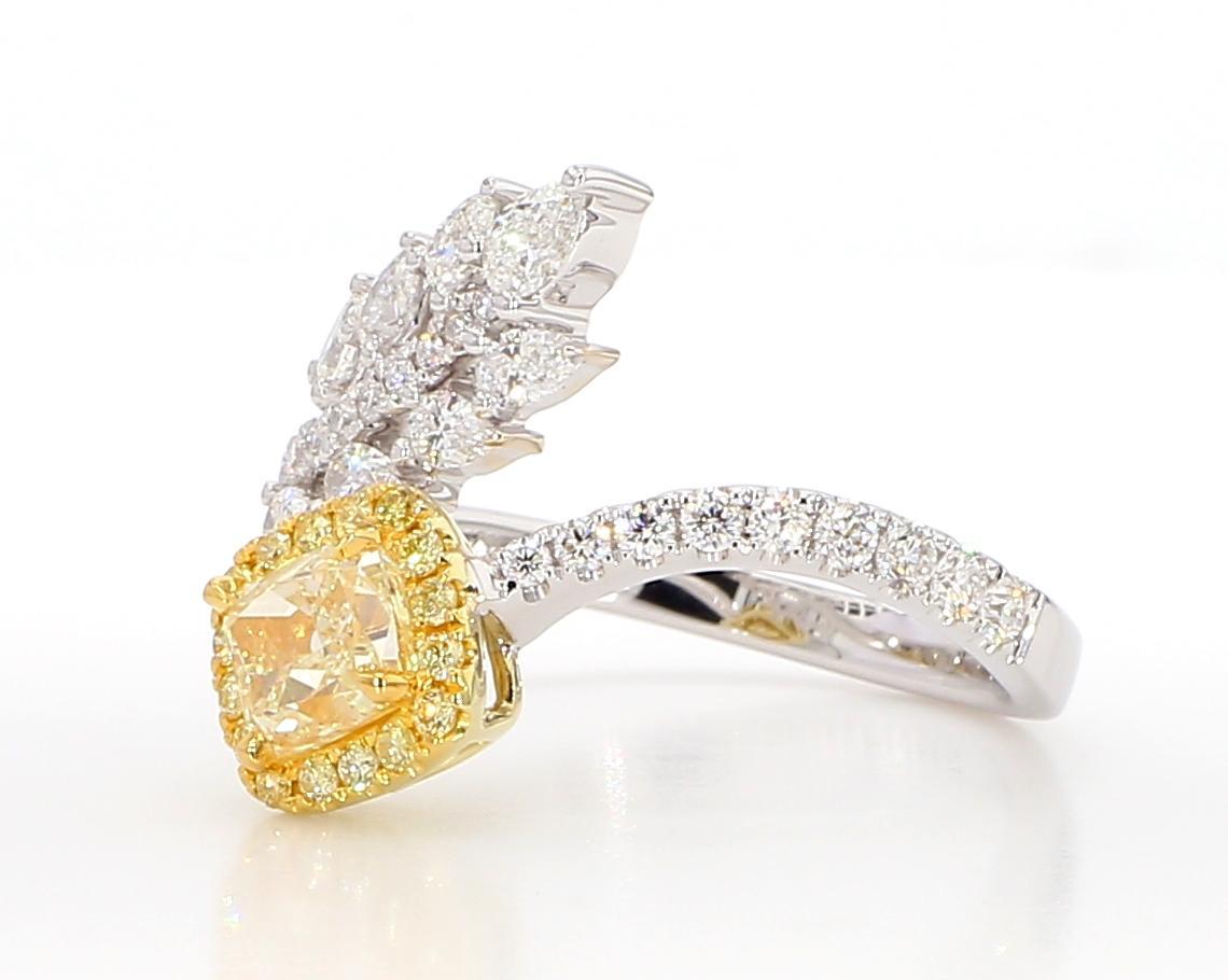 RareGemWorld's beautiful GIA certified diamond ring. Mounted in a beautiful 18K Yellow and White Gold setting with a natural cushion cut yellow diamond. The yellow diamond is surrounded by natural pear cut white diamonds, round natural yellow