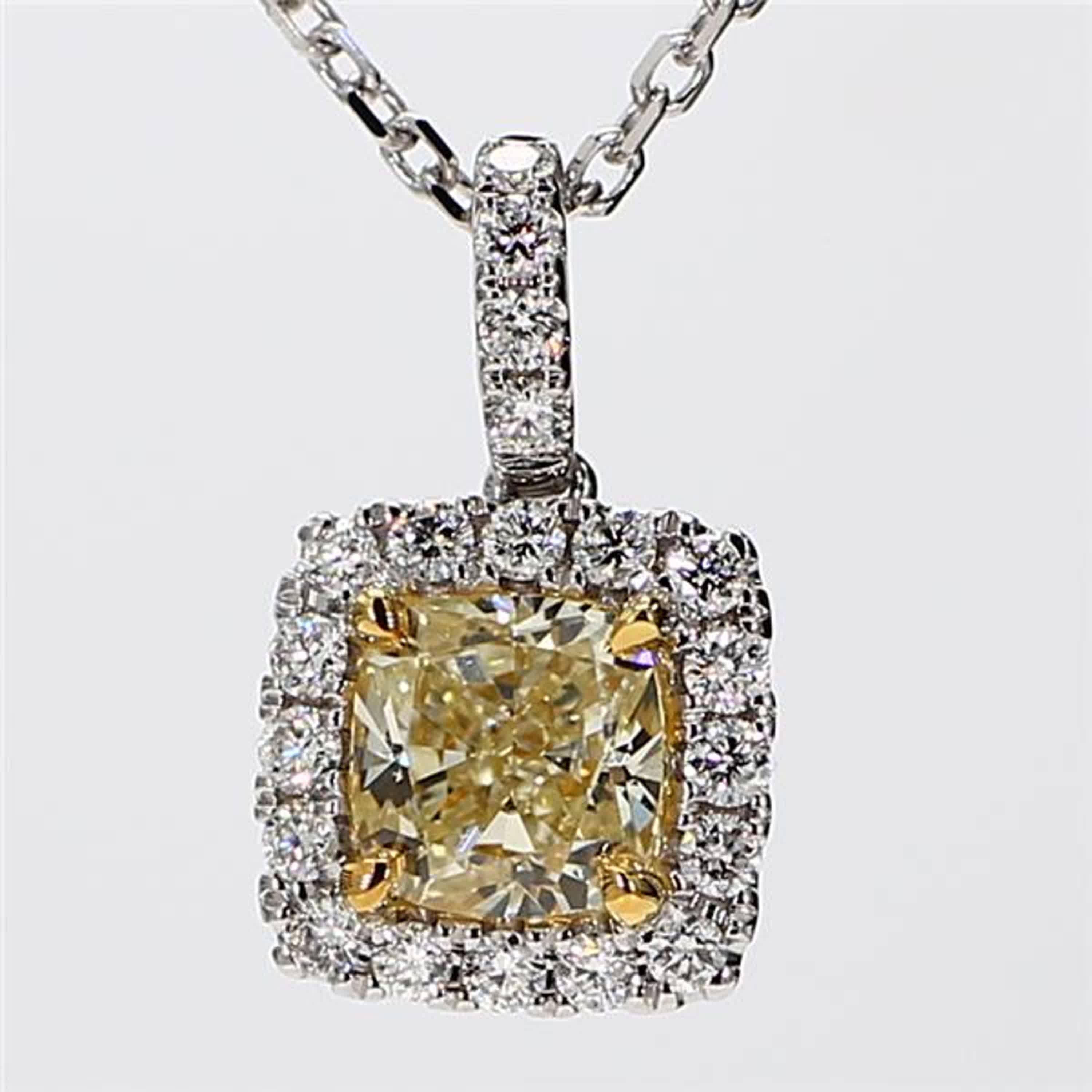 RareGemWorld's intriguing GIA certified diamond pendant. Mounted in a beautiful 18K Yellow and White Gold setting with a natural cushion cut yellow diamond. The yellow diamond is surrounded by small round natural white diamond melee. This pendant is