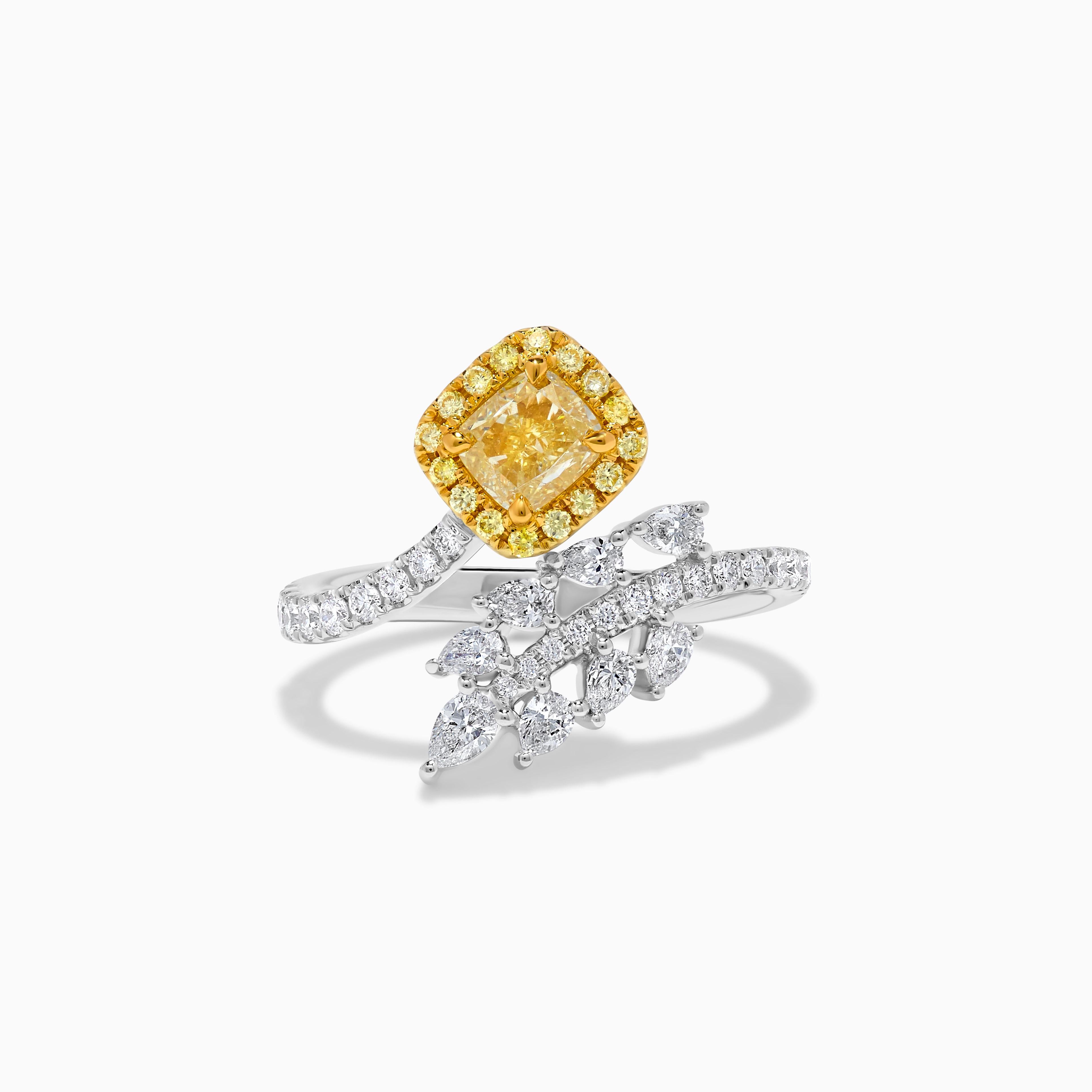 RareGemWorld's classic GIA certified diamond ring. Mounted in a beautiful 18K Yellow and White Gold setting with a natural cushion cut yellow diamond. The yellow diamond is surrounded by natural pear cut white diamonds, round natural yellow diamond