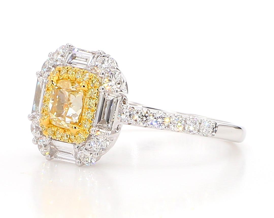 RareGemWorld's beautiful GIA certified diamond ring. Mounted in a beautiful 18K Yellow and White Gold setting with a natural cushion cut yellow diamond. The yellow diamond is surrounded by natural baguette cut white diamonds, round natural yellow