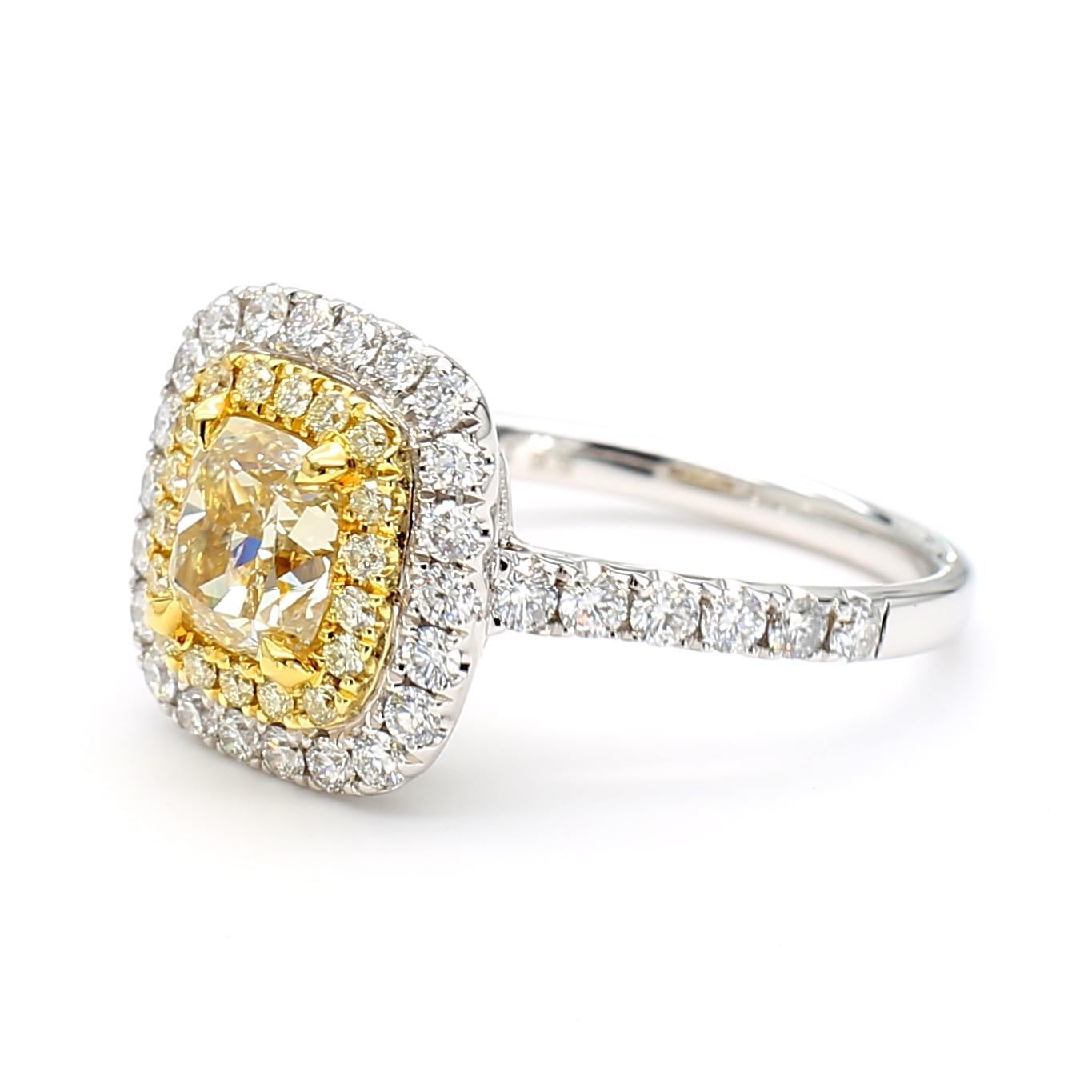 RareGemWorld's beautiful GIA certified diamond ring. Mounted in a beautiful 18K Yellow and White Gold setting with a natural cushion cut yellow diamond. The yellow diamond is surrounded by round natural yellow diamond melee and round natural white