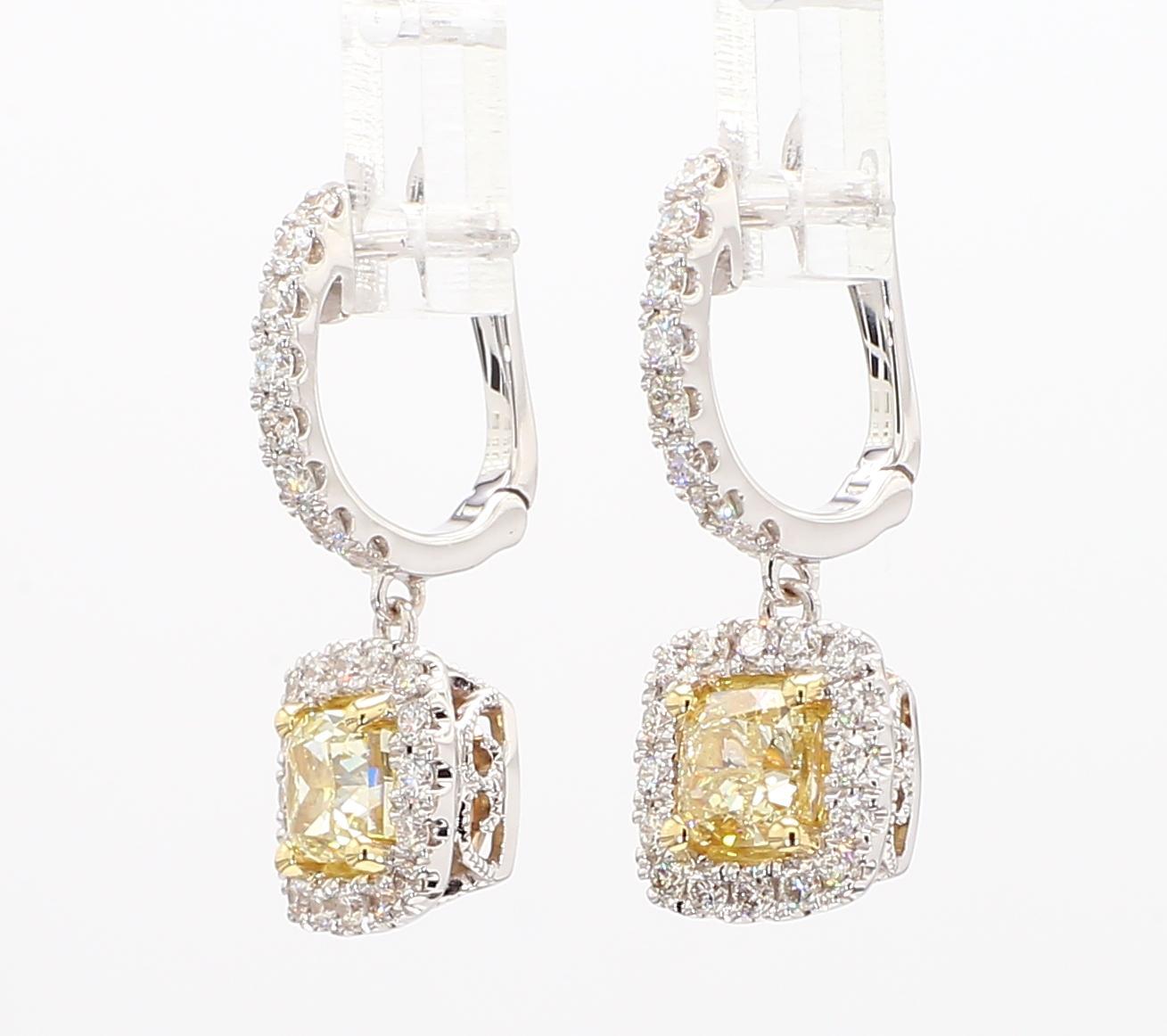 RareGemWorld's beautiful GIA certified diamond earrings. Mounted in a beautiful 18K Yellow and White Gold setting with natural cushion cut yellow diamonds. The yellow diamonds are surrounded by round natural white diamond melee. These earrings are