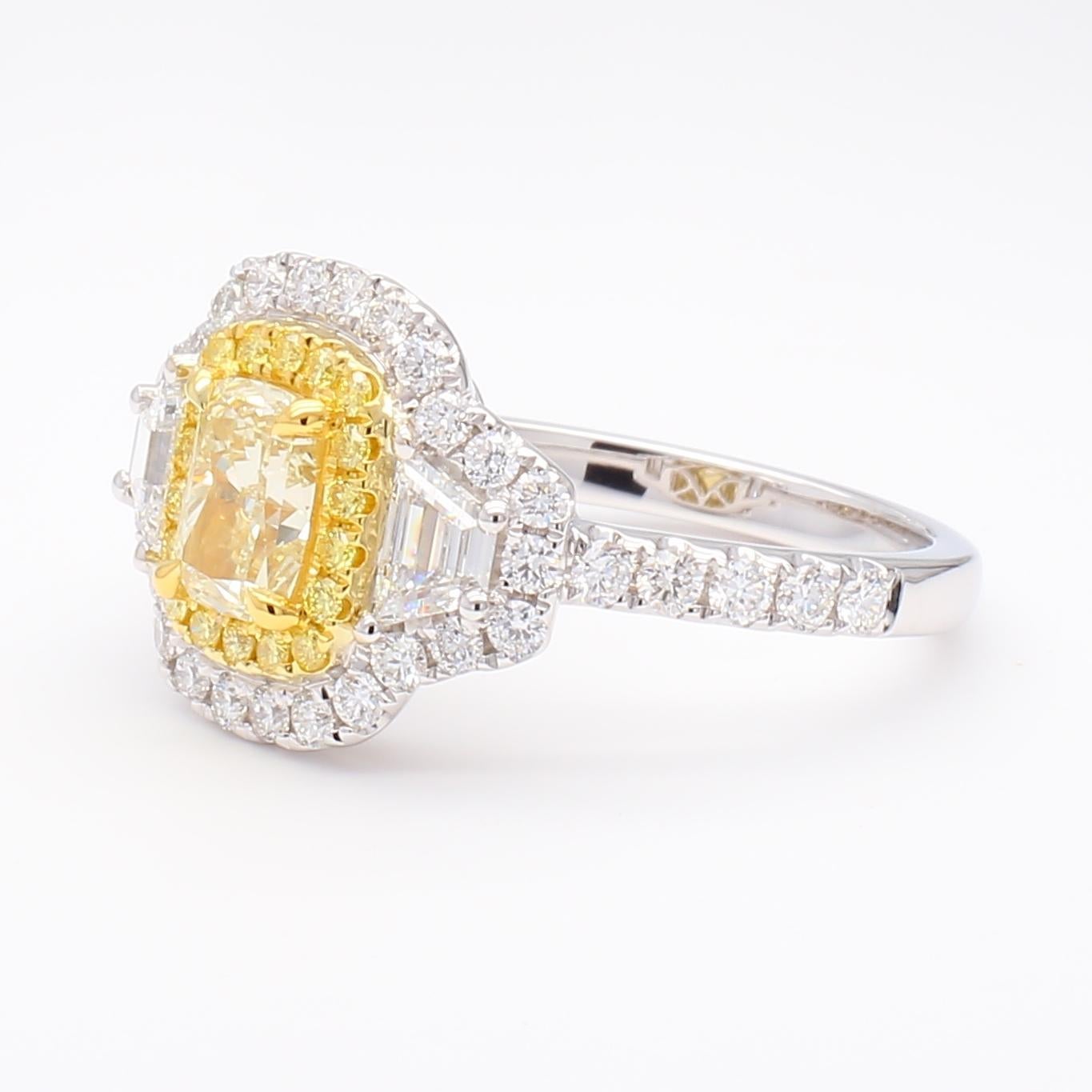 RareGemWorld's beautiful GIA certified diamond cocktail ring. Mounted in a beautiful 18K Gold and Platinum setting with a natural cushion cut yellow diamond. The yellow diamond is surrounded by natural trapezoid cut white diamonds, round natural