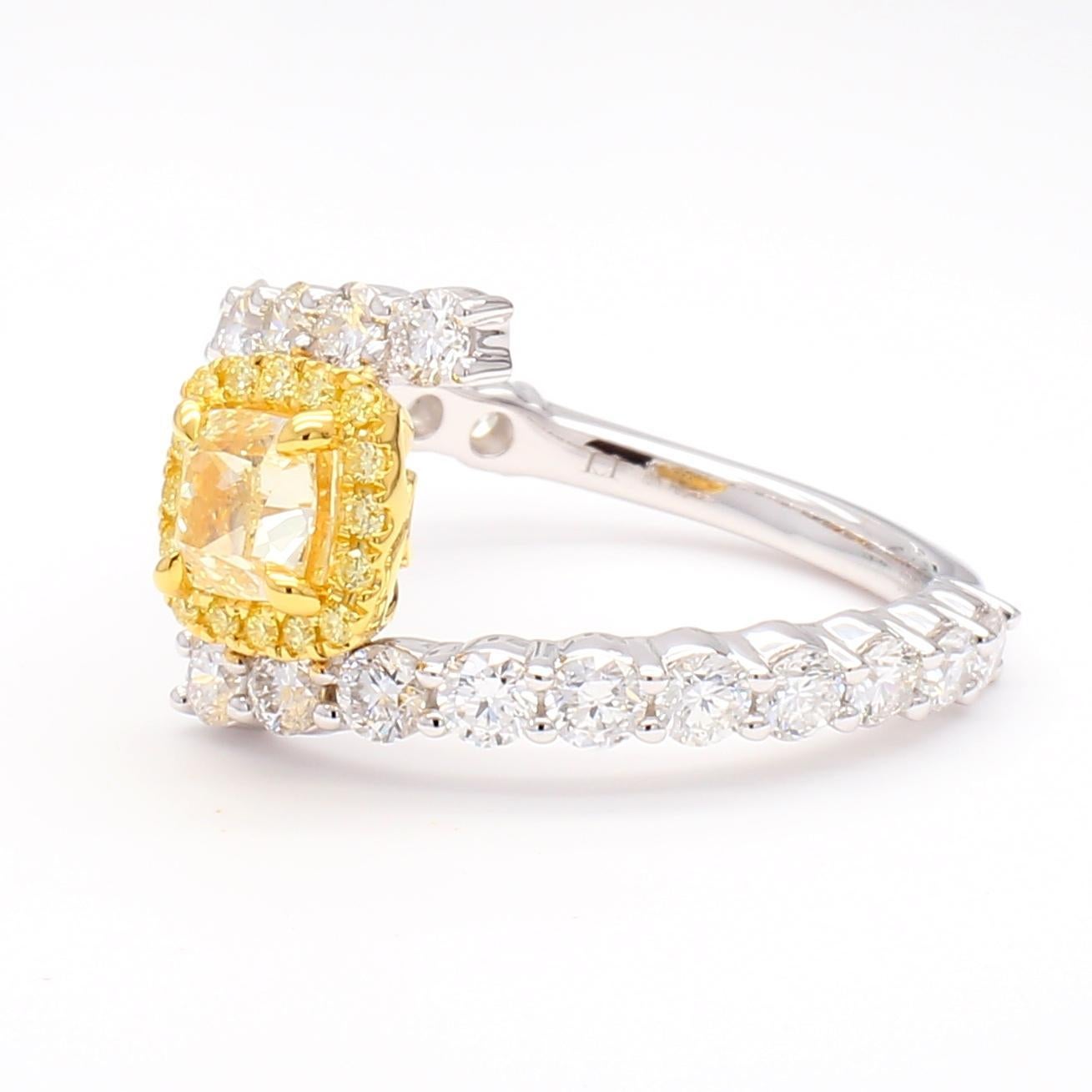 RareGemWorld's beautiful GIA certified diamond ring. Mounted in a beautiful 18K Yellow and White Gold setting with a natural cushion cut yellow diamond. The yellow diamond is surrounded by round natural yellow diamond melee and round natural white