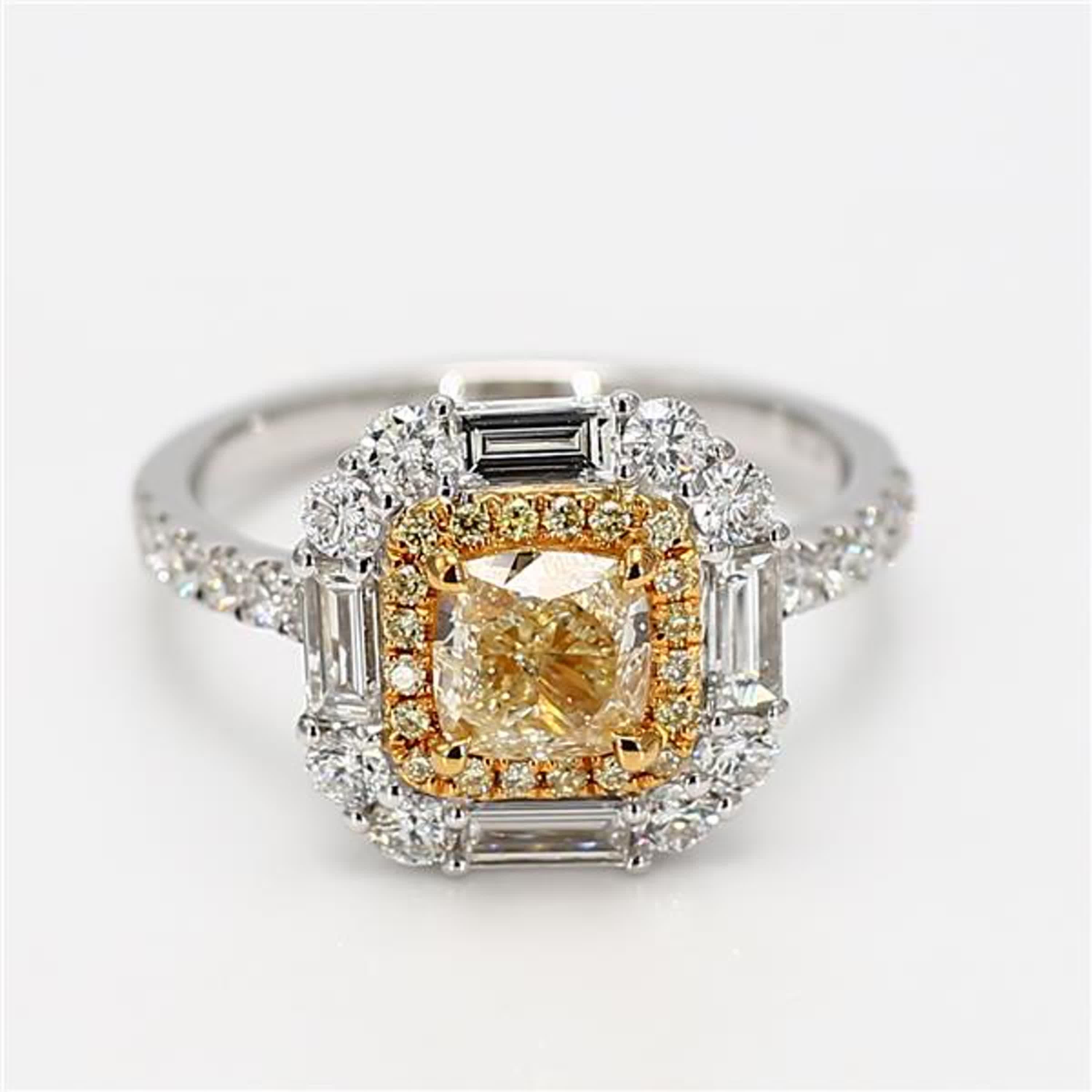 RareGemWorld's classic GIA certified diamond ring. Mounted in a beautiful 18K Yellow and White Gold setting with a natural cushion cut yellow diamond. The yellow diamond is surrounded by natural baguette cut white diamonds, round natural yellow