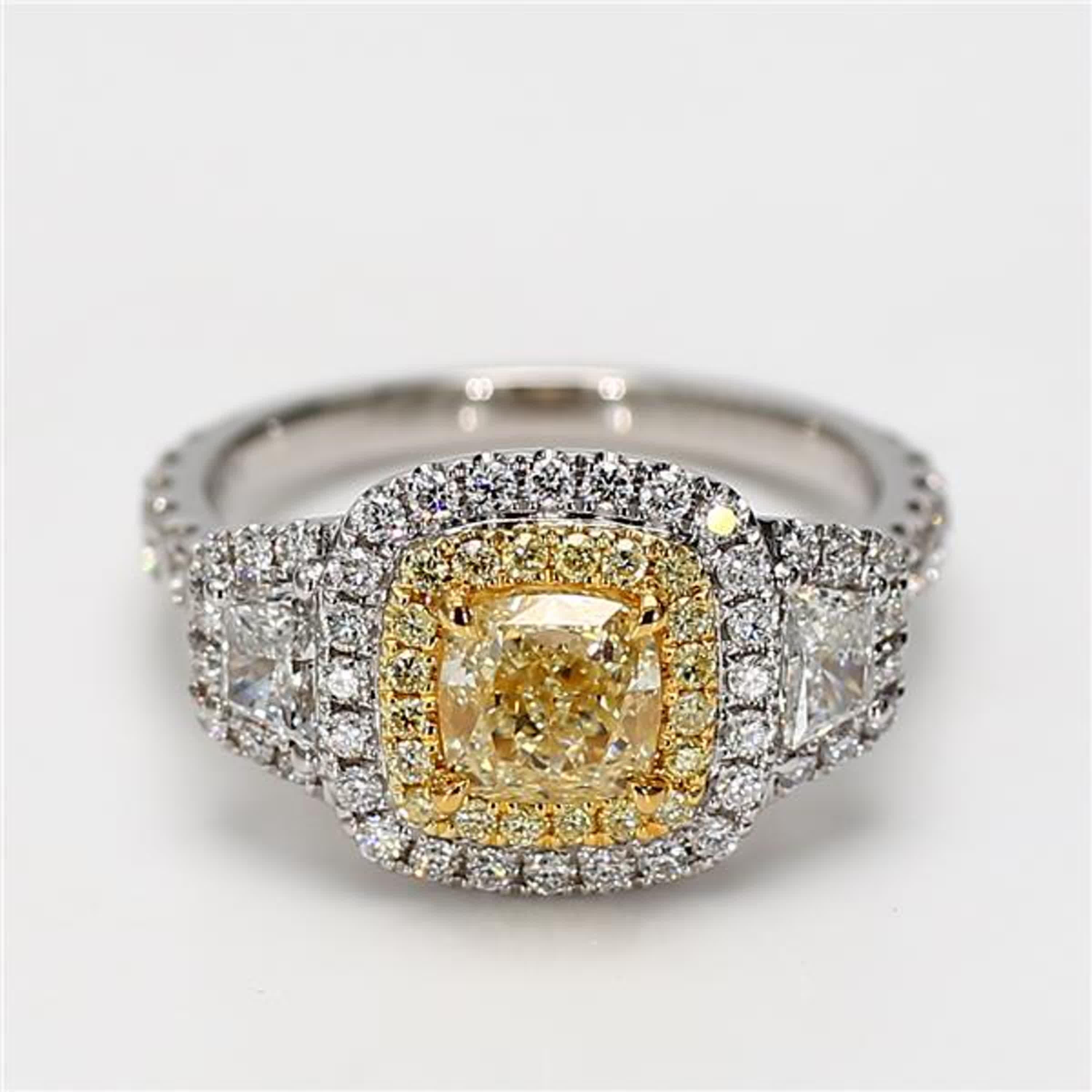 RareGemWorld's classic GIA certified diamond ring. Mounted in a beautiful 18K Yellow and White Gold setting with a natural cushion cut yellow diamond. The yellow diamond is surrounded by natural taper baguette white diamonds, round natural yellow