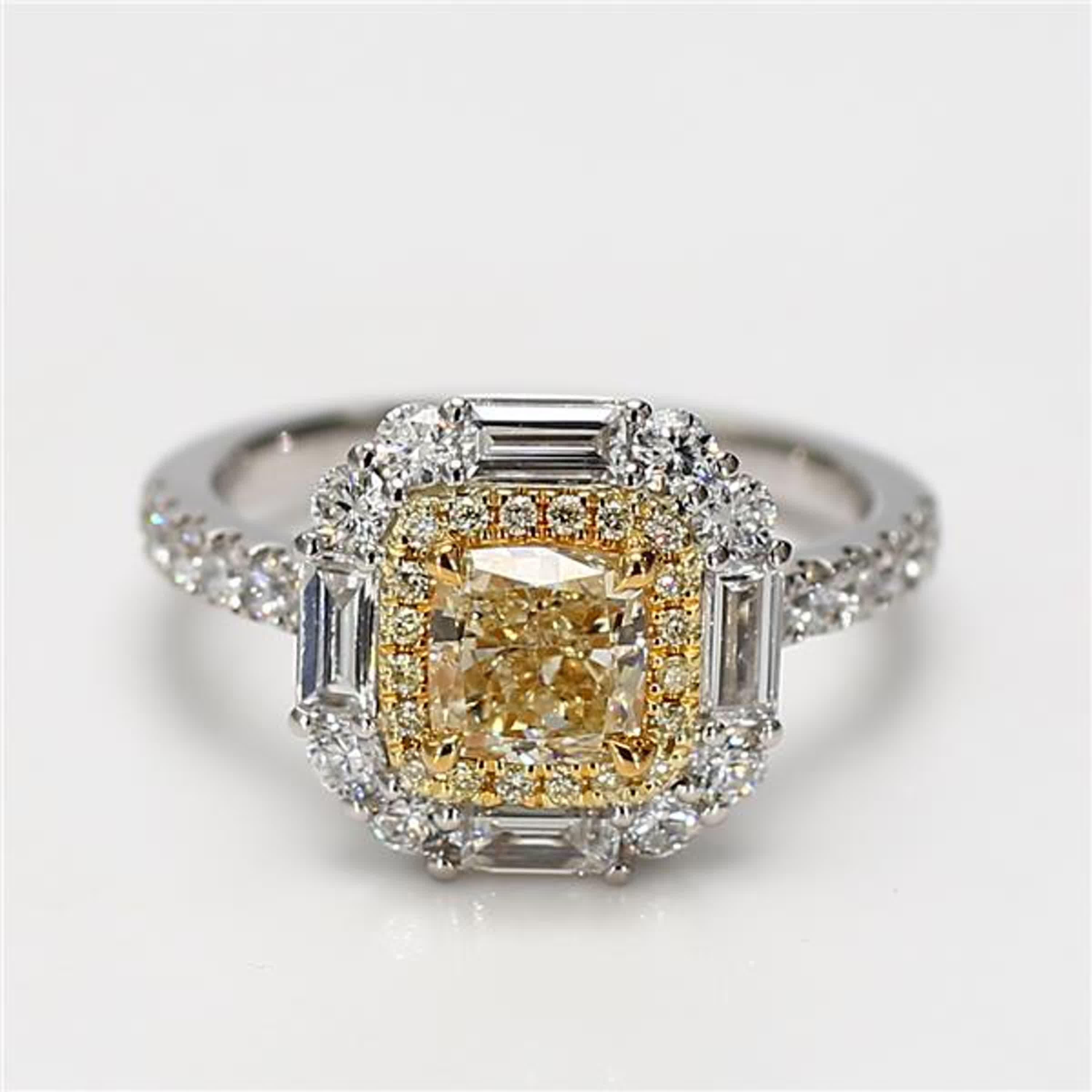 RareGemWorld's classic GIA certified diamond ring. Mounted in a beautiful 18K Yellow and White Gold setting with a natural cushion cut yellow diamond. The yellow diamond is surrounded by natural taper baguette white diamonds, round natural yellow