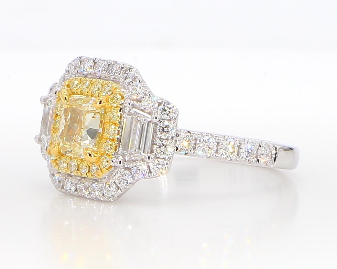 RareGemWorld's classic GIA certified diamond cocktail ring. Mounted in a beautiful 18K Yellow and White Gold setting with a natural cushion cut yellow diamond. The yellow diamond is surrounded by natural trapezoid cut white diamonds, round natural