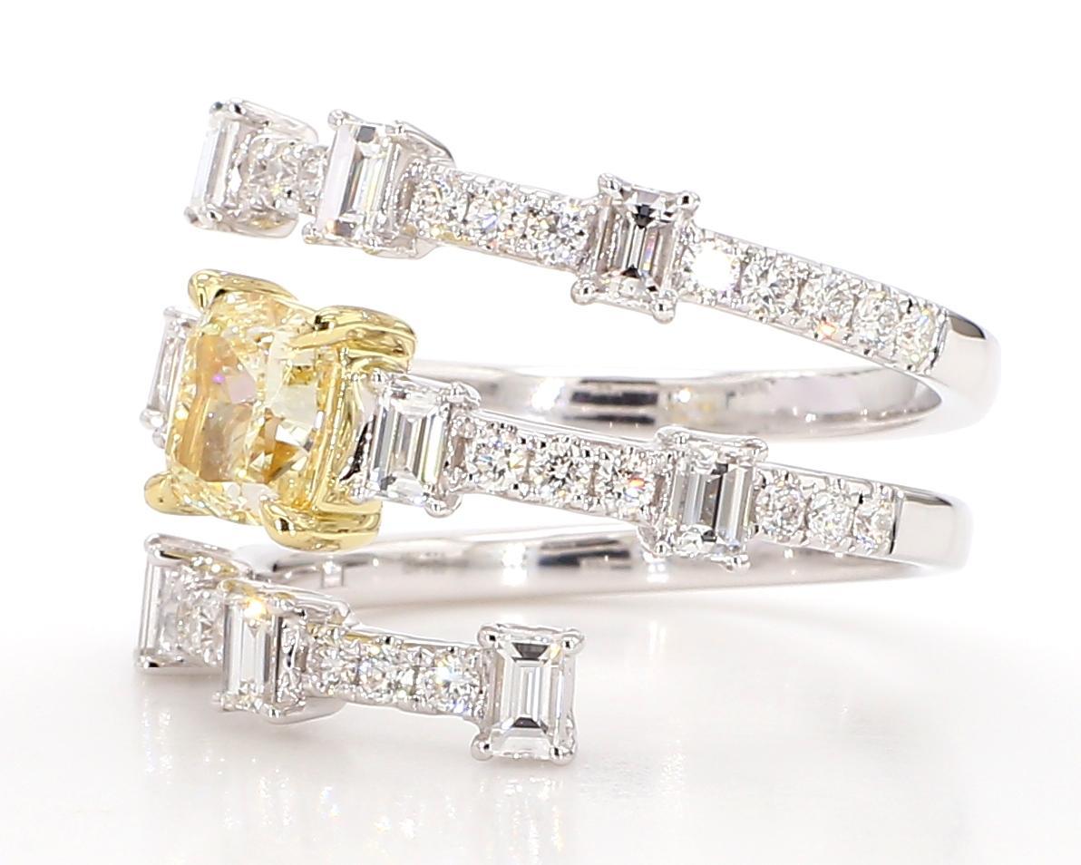 RareGemWorld's beautiful GIA certified diamond ring. Mounted in a beautiful 18K Yellow and White Gold setting with a natural cushion cut yellow diamond. The yellow diamond is surrounded by natural baguette cut white diamonds and round natural white