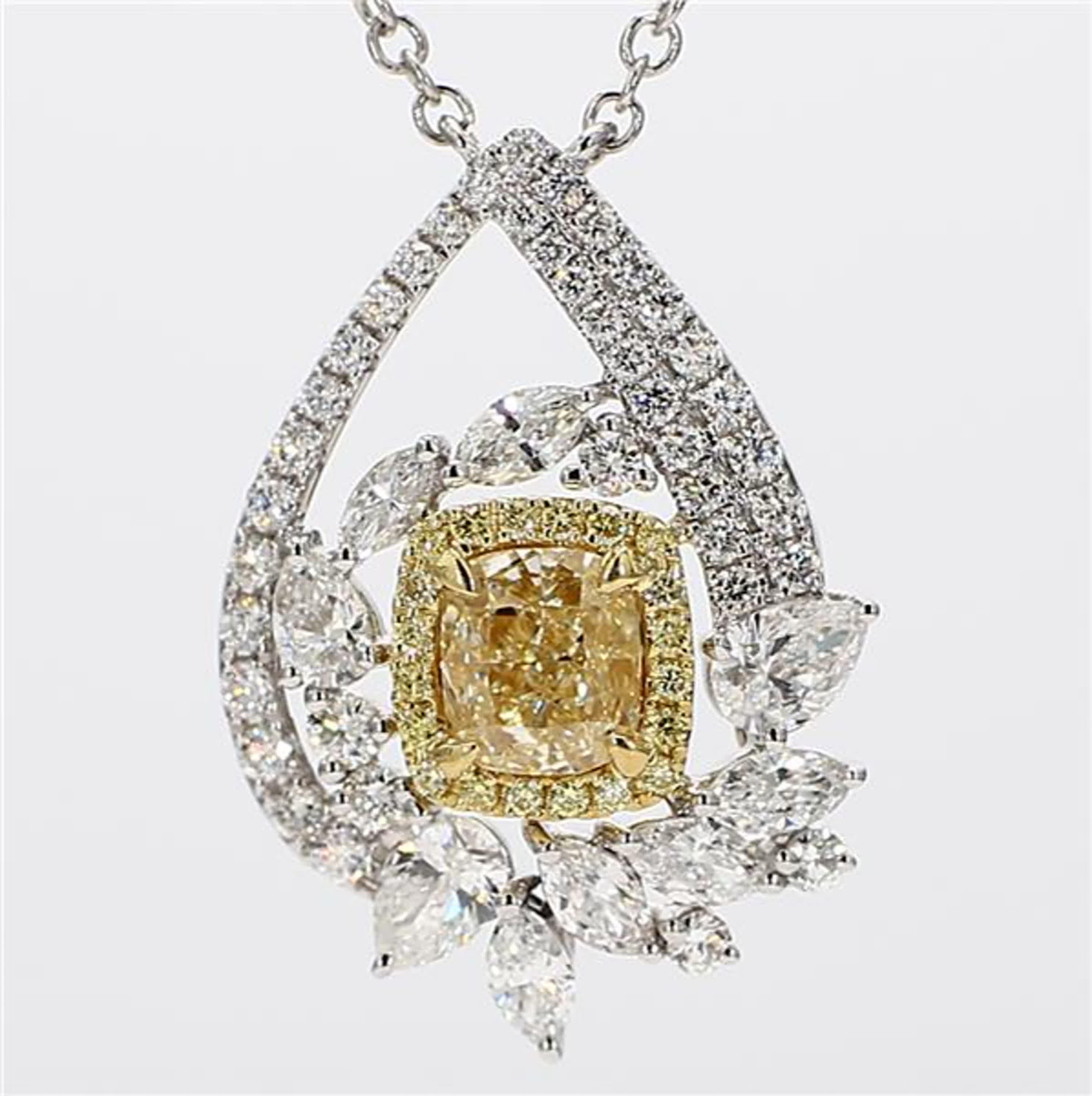 RareGemWorld's intriguing GIA certified diamond necklace. Mounted in a beautiful 18K Yellow and White Gold setting with a natural cushion cut yellow diamond. The yellow diamond is surrounded by natural pear cut white diamonds, natural marquise cut