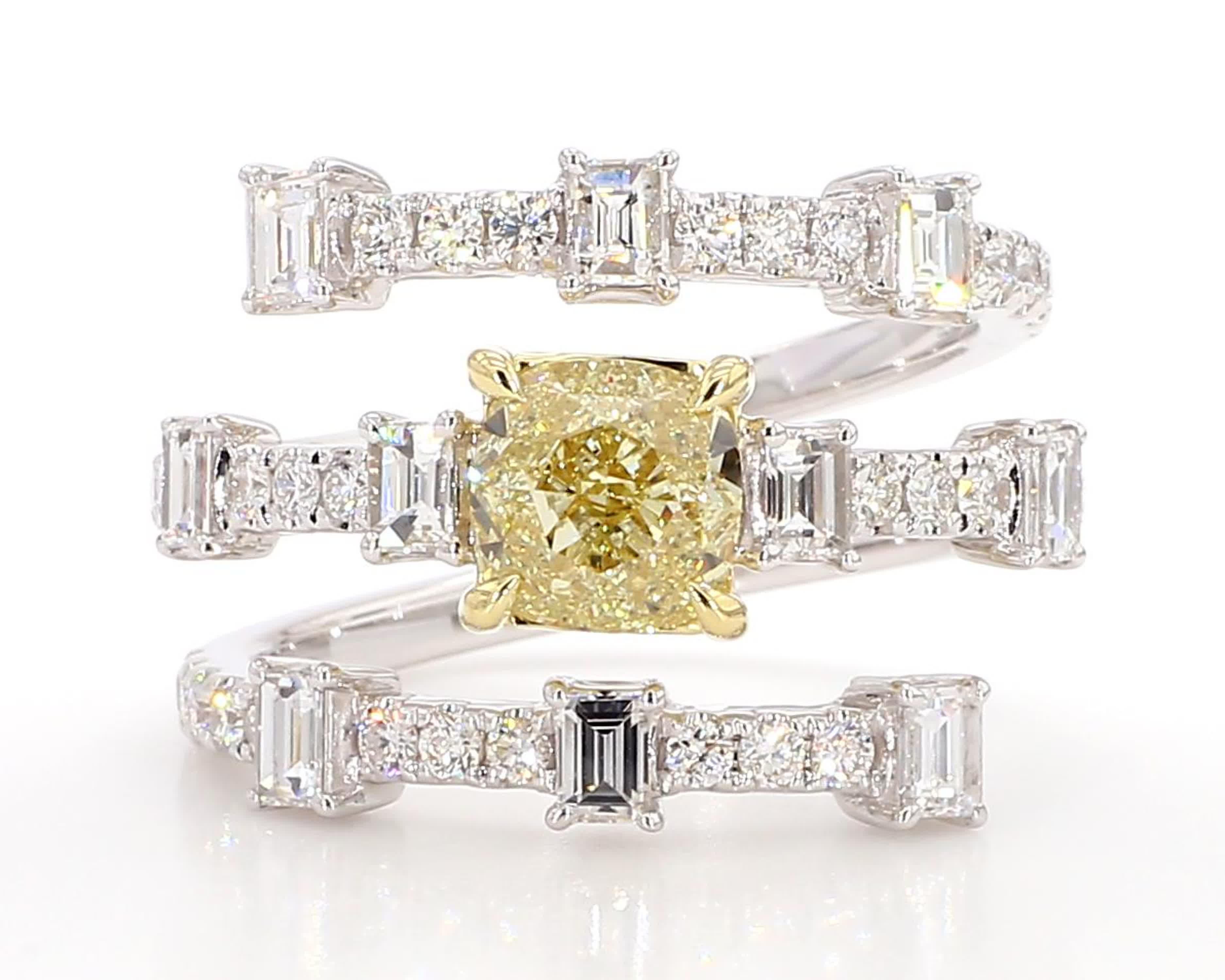 RareGemWorld's classic GIA certified diamond cocktail ring. Mounted in a beautiful 18K Yellow and White Gold setting with a natural cushion cut yellow diamond. The yellow diamond is surrounded by natural baguette cut white diamonds and round natural