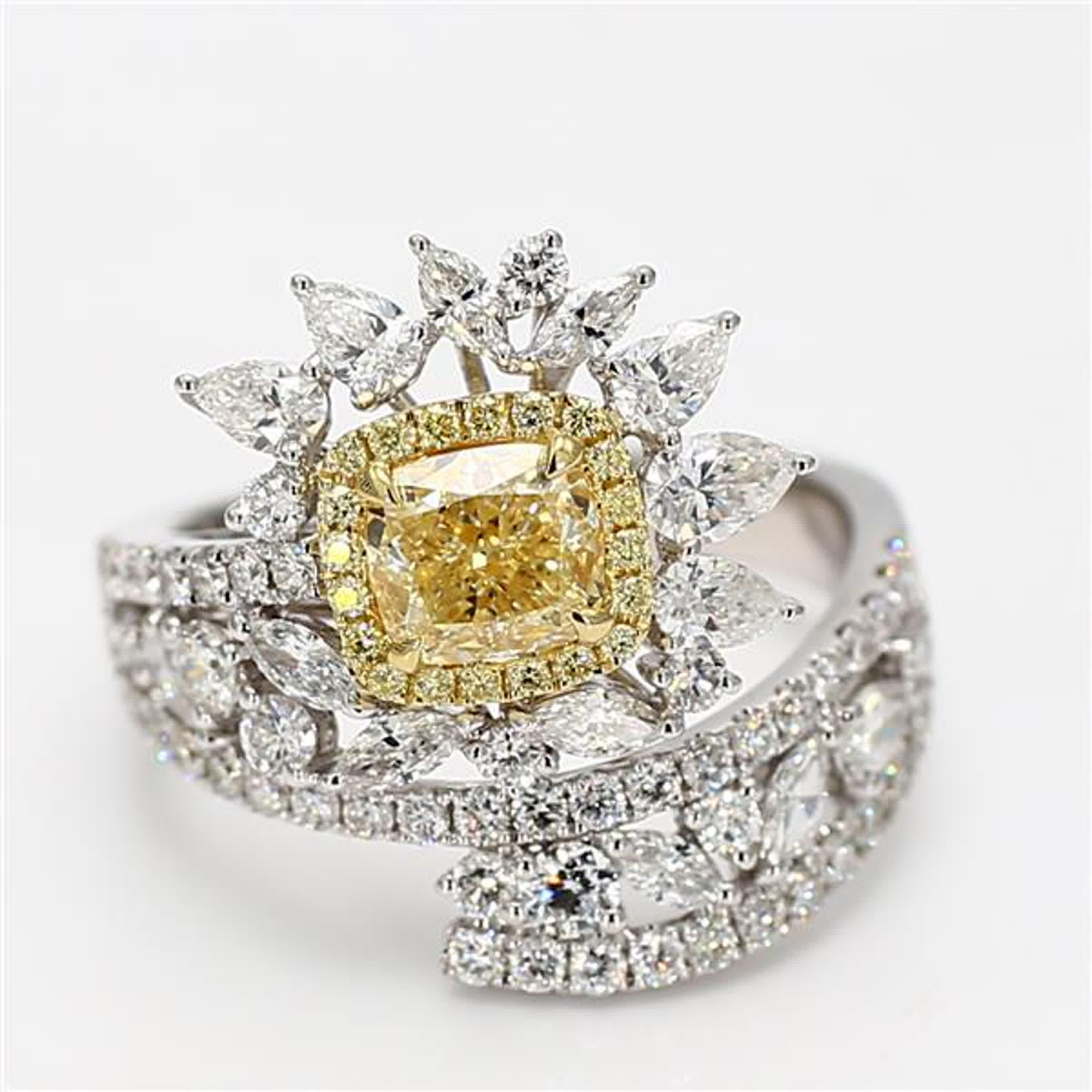 RareGemWorld's classic GIA certified diamond ring. Mounted in a beautiful 18K Yellow and White Gold setting with a natural cushion cut yellow diamond. The yellow diamond is surrounded by natural marquise cut white diamonds, natural princess cut