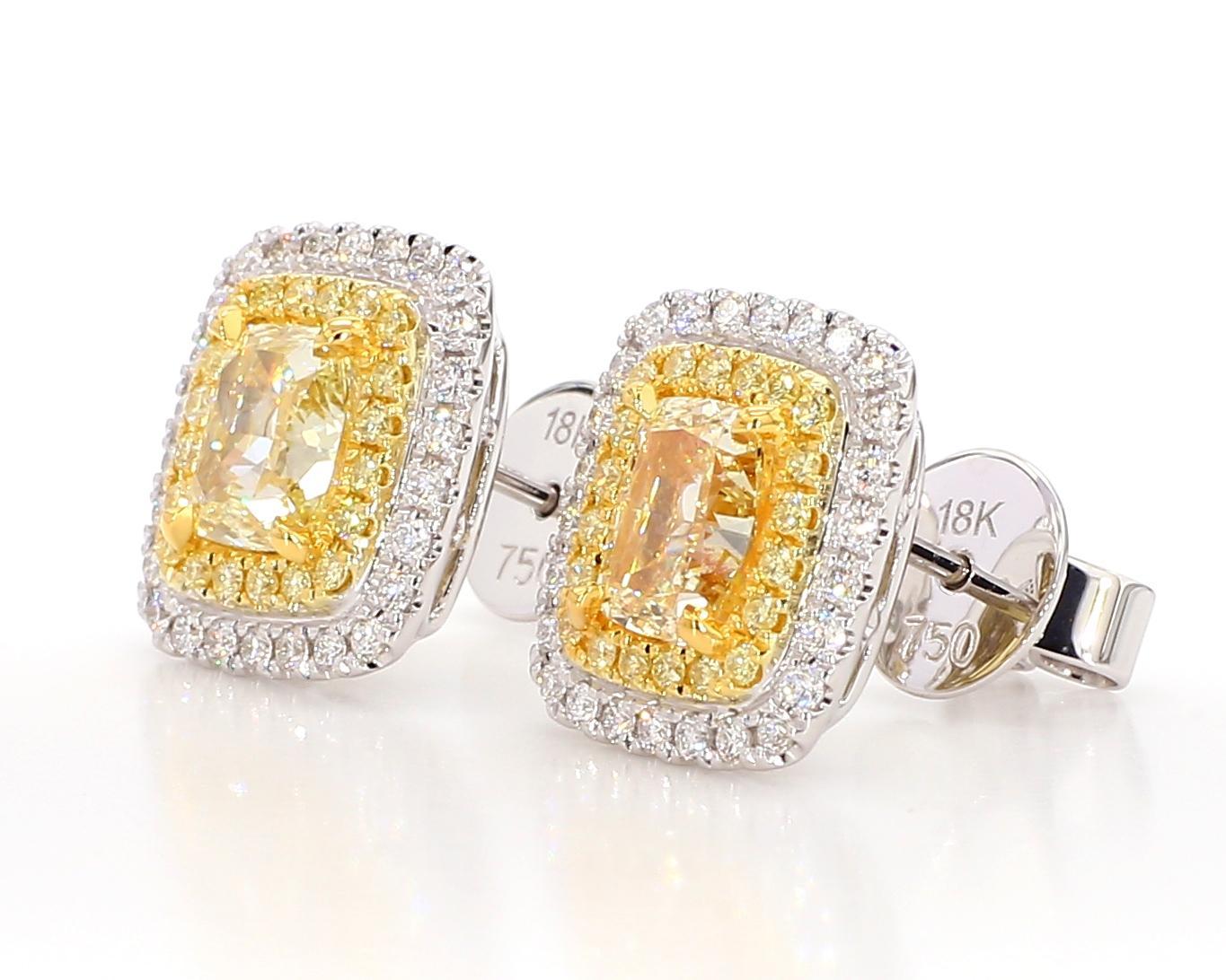 RareGemWorld's beautiful diamond earrings. Mounted in a beautiful 18K Yellow and White Gold setting with natural cushion cut yellow diamonds. The yellow diamonds are surrounded by round natural white diamond melee and round natural yellow diamond