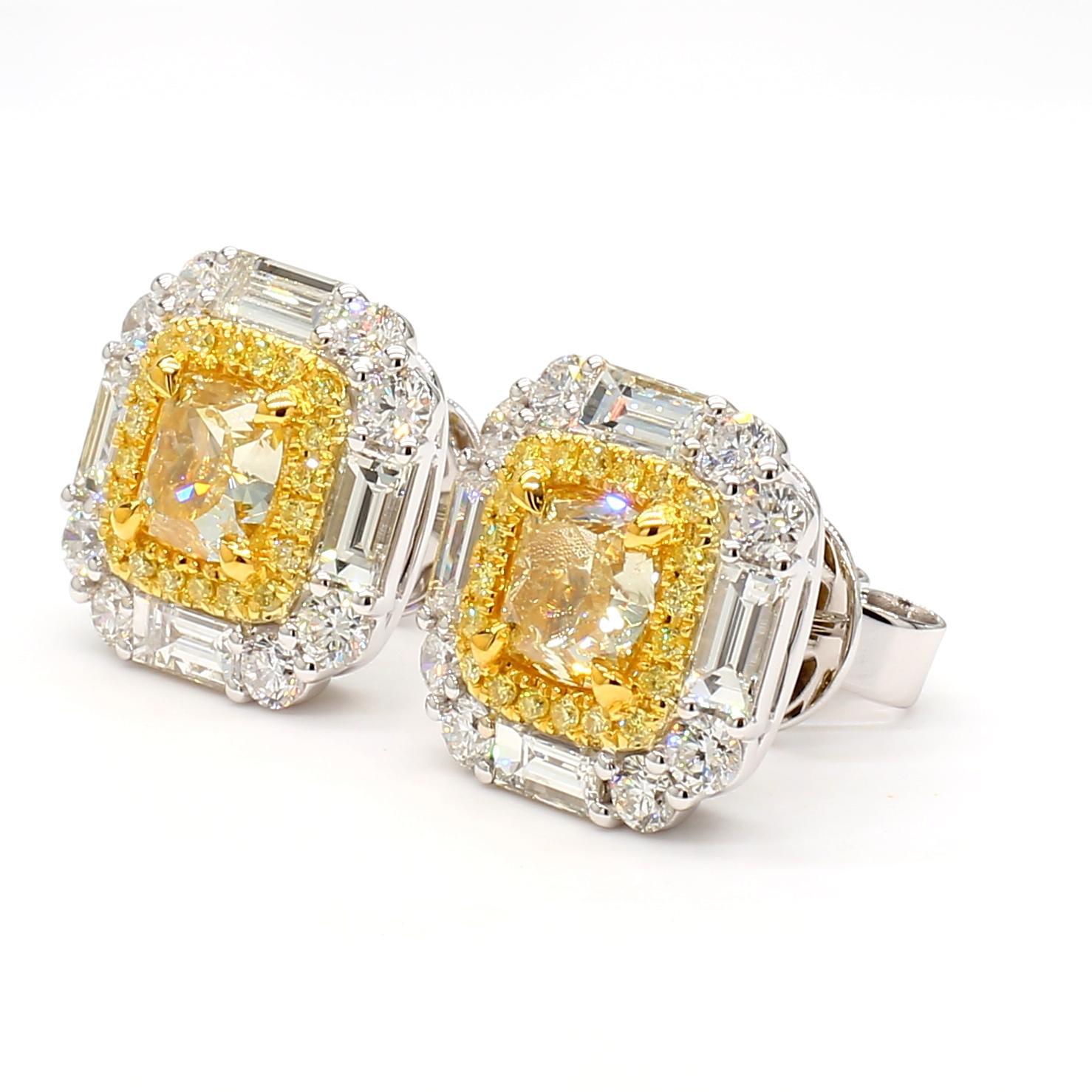 RareGemWorld's beautiful GIA certified diamond earrings. Mounted in a beautiful 18K Yellow and White Gold setting with natural cushion cut yellow diamonds. The yellow diamonds are surrounded by natural white baguette cut diamond, round natural white