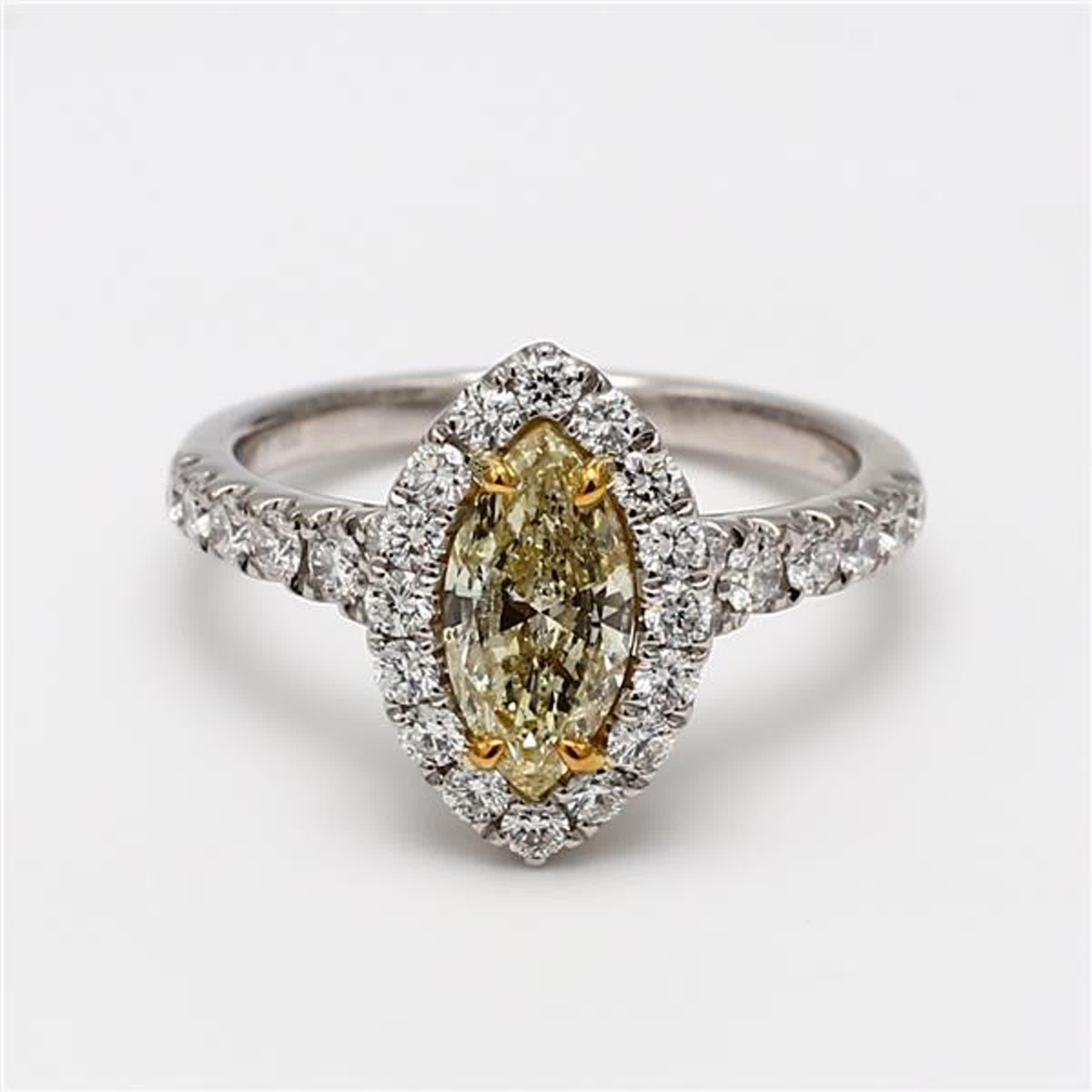 RareGemWorld's classic GIA certified diamond ring. Mounted in a beautiful 18K Yellow and White Gold and Platinum setting with a natural marquise cut yellow diamond. The yellow diamond is surrounded by round natural white diamond melee. This ring is