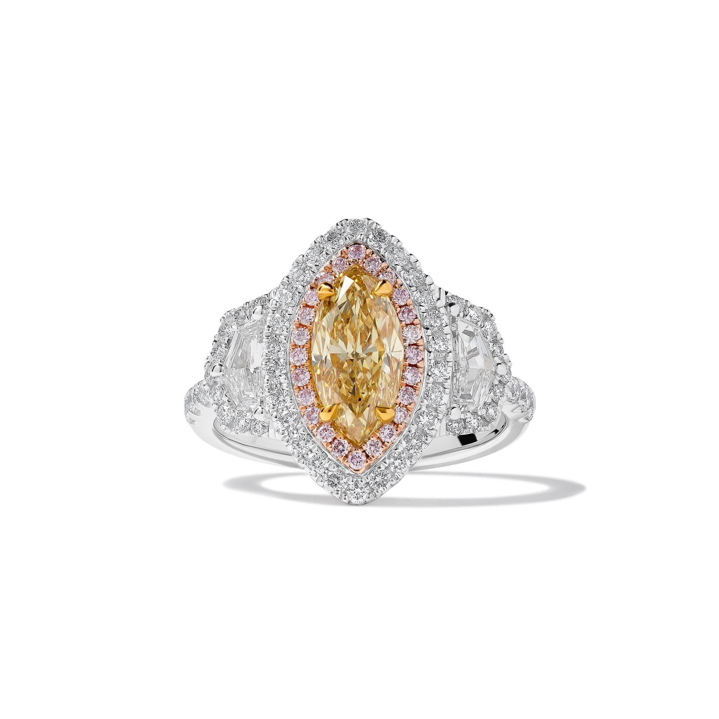 RareGemWorld's classic GIA certified diamond ring. Mounted in a beautiful 18K Rose and White Gold setting with a natural marquise cut yellow diamond. The yellow diamond is surrounded by two GIA certified natural epaulette cut white diamonds, round