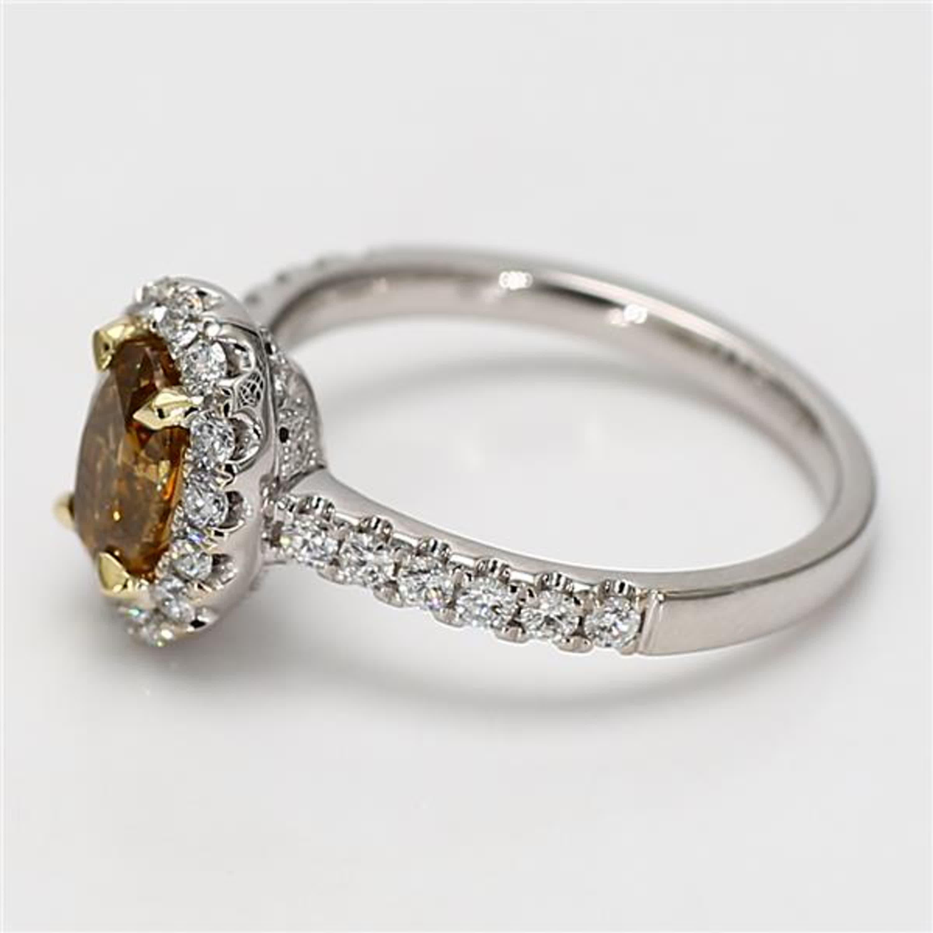 RareGemWorld's classic GIA certified diamond ring. Mounted in a beautiful 18K Yellow and White Gold setting with a natural oval cut yellow diamond. The yellow diamond is surrounded by small round natural white diamond melee. This ring is guaranteed