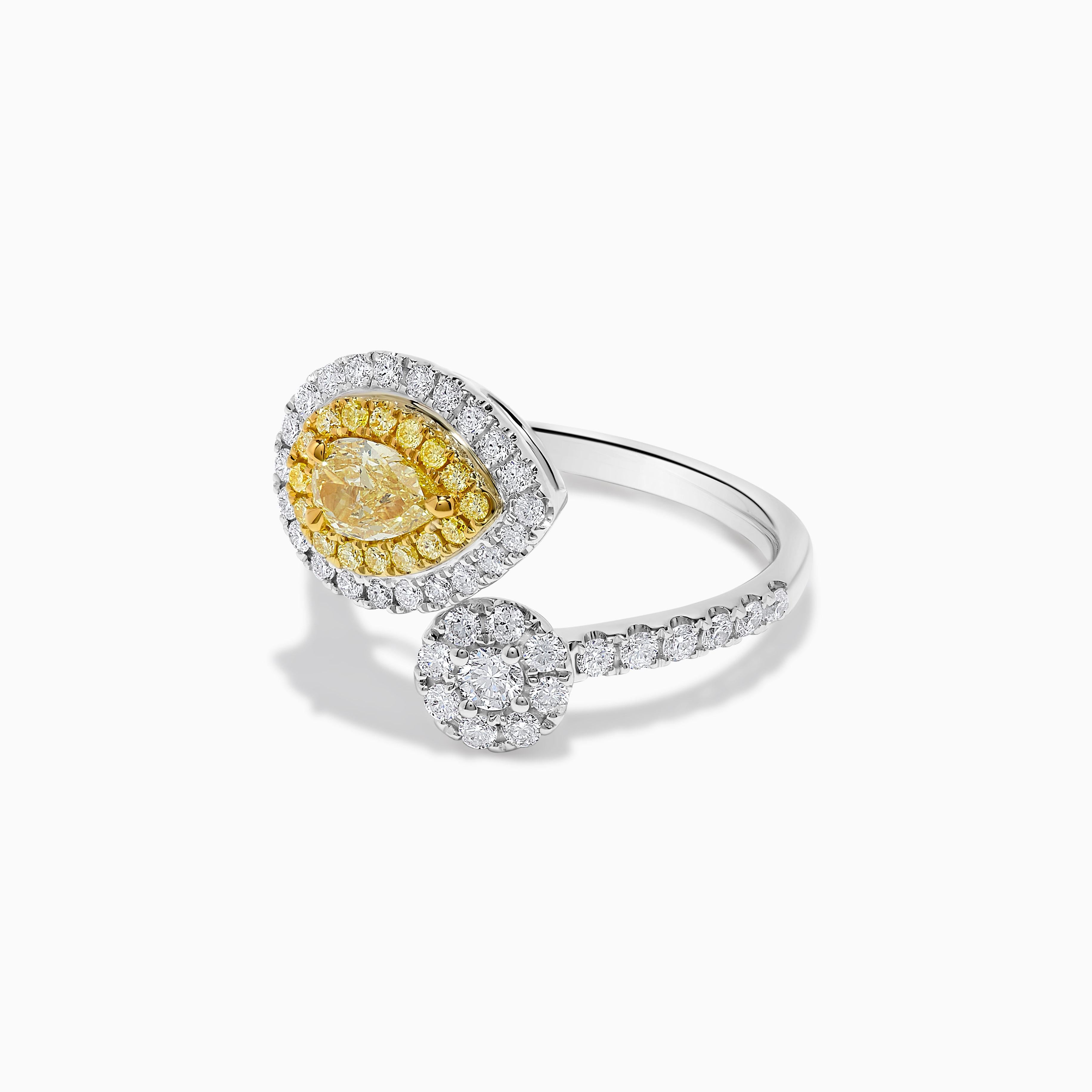 RareGemWorld's classic GIA certified diamond ring. Mounted in a beautiful 18K Yellow and White setting with a natural pear cut yellow diamond. The yellow diamond is surrounded by round natural white diamond melee and round natural yellow diamond