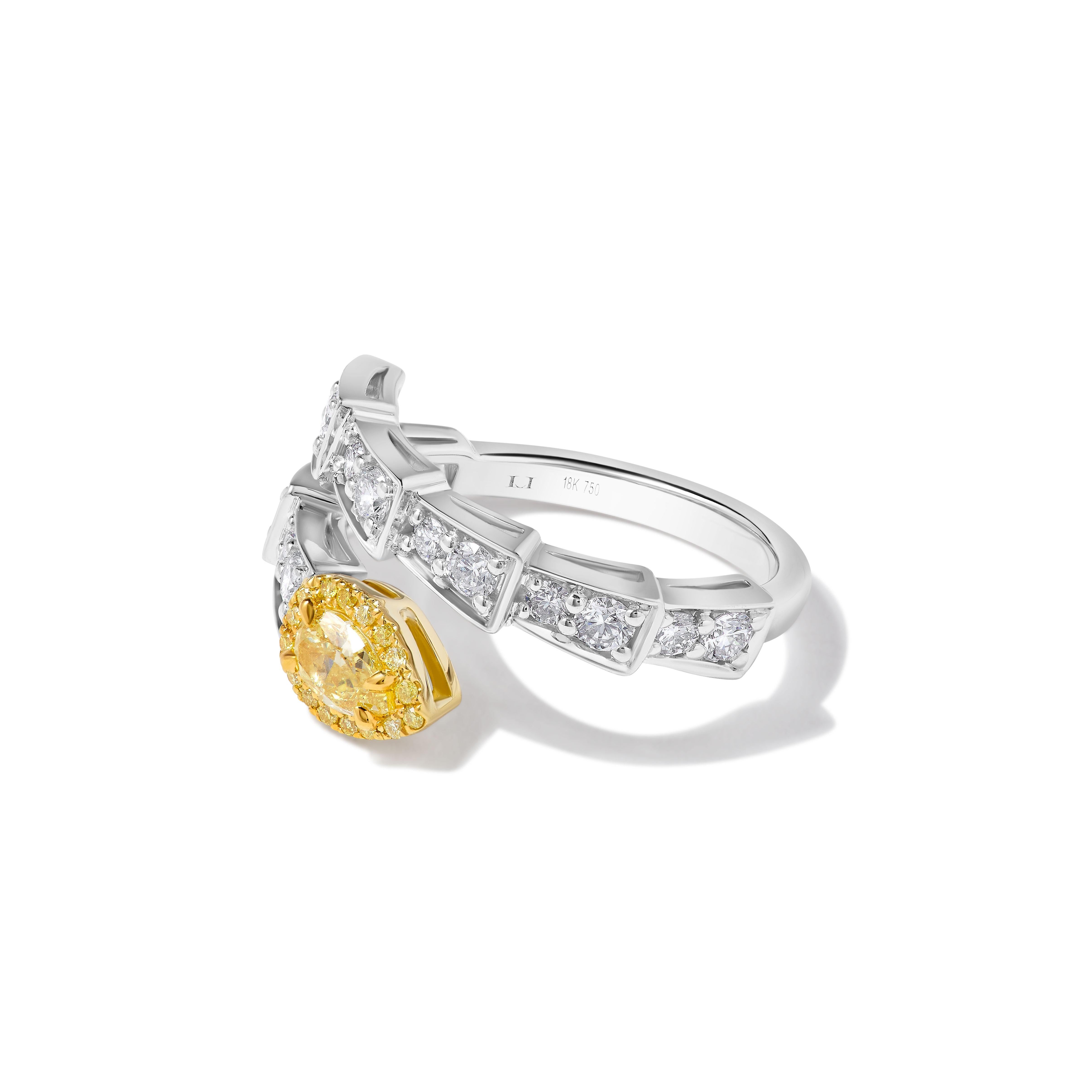 RareGemWorld's GIA certified diamond ring. Mounted in a beautiful 18K Yellow and White setting with a natural pear cut yellow diamond. The yellow diamond is surrounded by natural baguette cut white diamonds, round natural white diamond melee, and