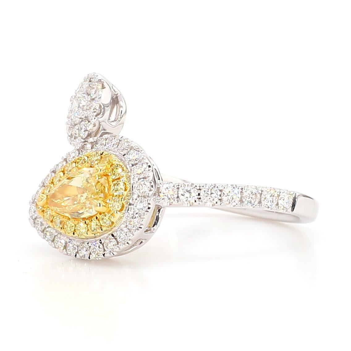 RareGemWorld's beautiful GIA certified diamond ring. Mounted in a beautiful 18K Yellow and White setting with a natural pear cut yellow diamond. The yellow diamond is surrounded by round natural white diamond melee and round natural yellow diamond