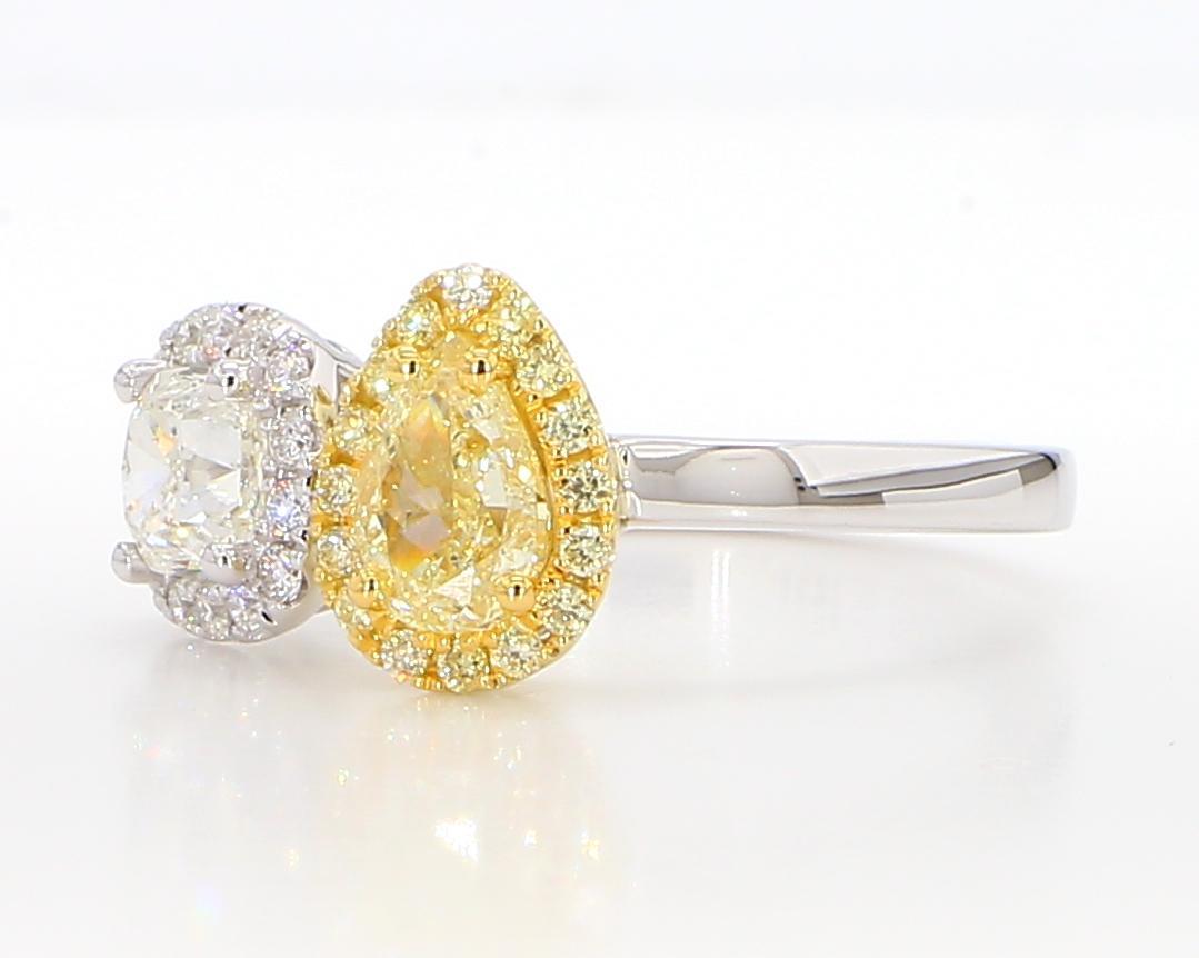 RareGemWorld's beautiful diamond ring. Mounted in a beautiful 18K Yellow and White Gold setting with a certified natural pear cut yellow diamond complimented by a natural cushion cut white diamond. The diamonds are surrounded by round natural white