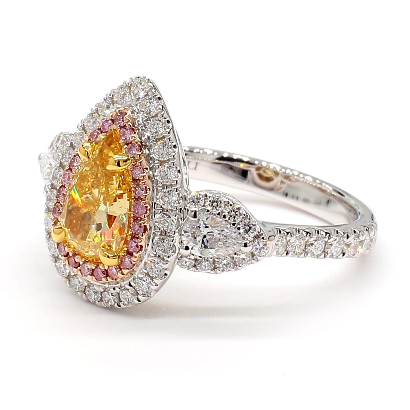 RareGemWorld's beautiful GIA certified diamond ring. Mounted in a beautiful 18K Rose and White setting with a natural pear cut orangy yellow diamond. The diamond is surrounded by natural pear cut white diamonds as well as round cut natural white