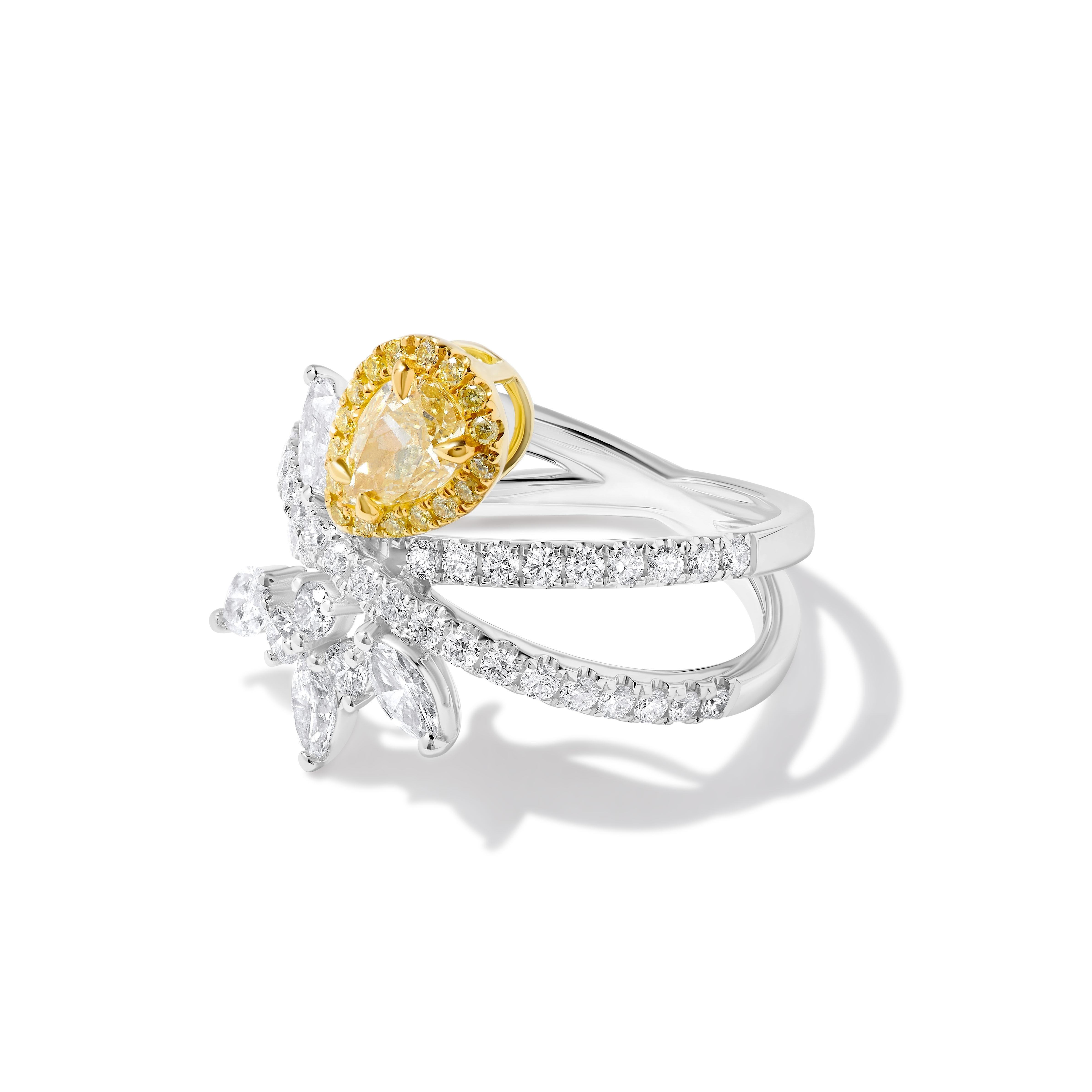 RareGemWorld's beautiful GIA certified diamond ring. Mounted in a beautiful 18K Yellow and White setting with a natural pear cut yellow diamond. The yellow diamond is surrounded by natural marquise cut white diamonds, round natural white diamond